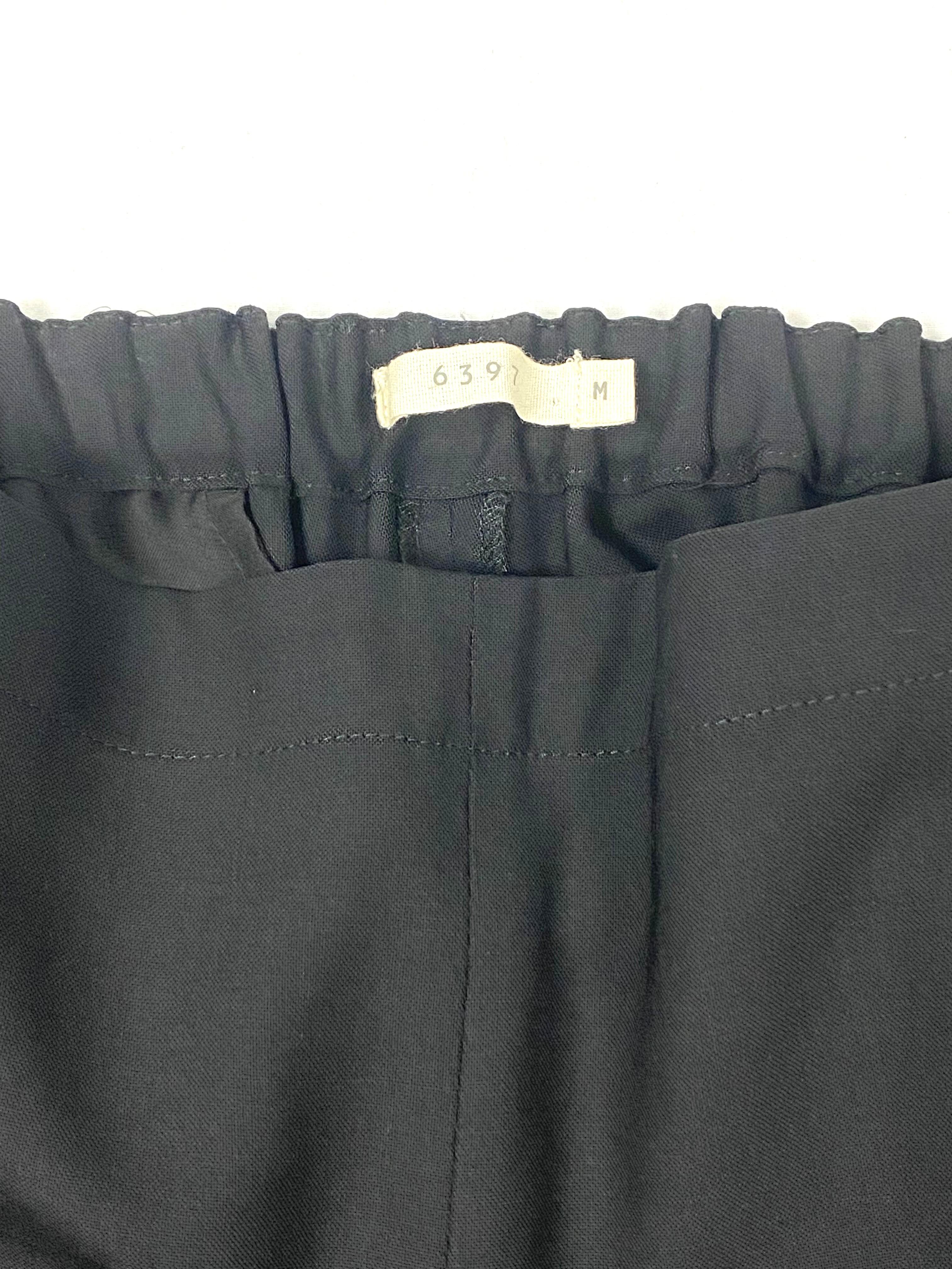 Product details:

The pants are made of 96% wool, it features black color with stretchy elastic on the back of the waist, pockets on the sides and one pocket on the back. Made in USA.