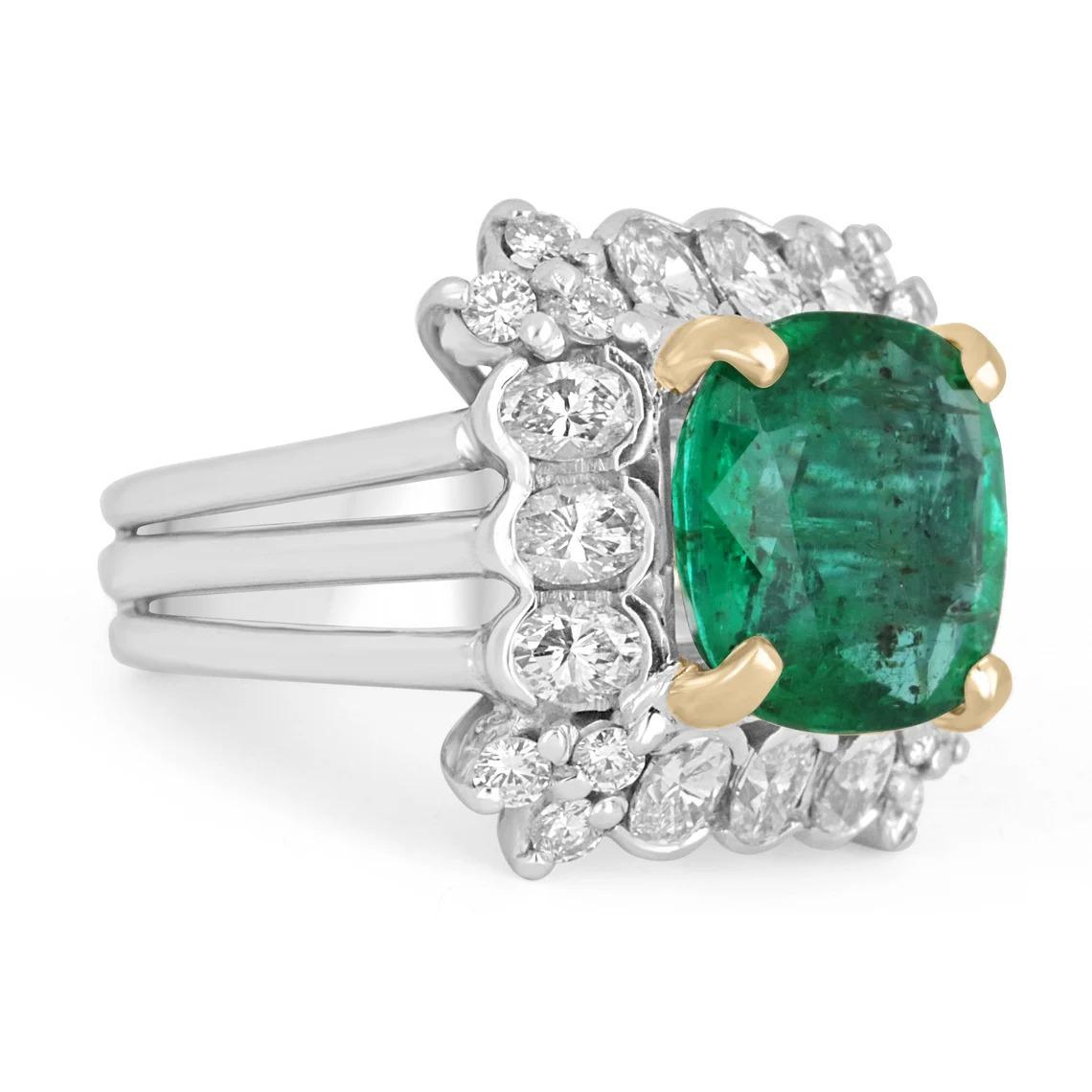 An extraordinary, custom-made Emerald & Diamond Cocktail Ring. The center stone features an impressive 4.89-carat natural Zambian emerald with gorgeous characteristics. The gemstone displays a desirable, yellowish-dark green color, and