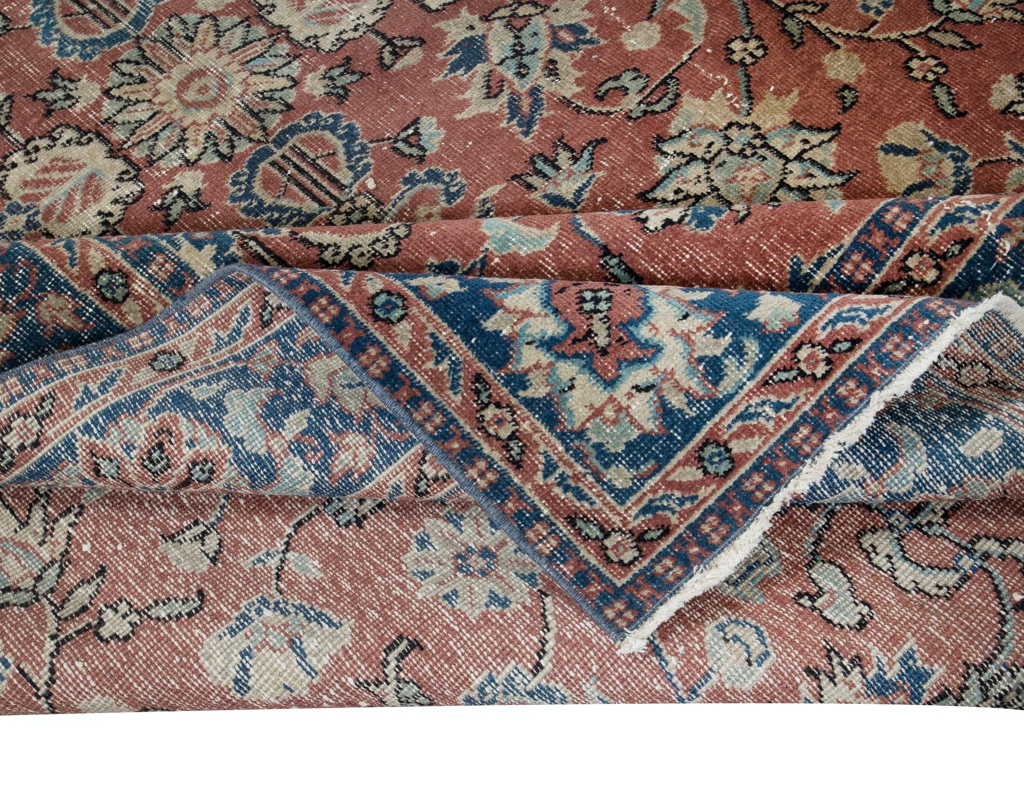 A finely hand-knotted vintage Turkish carpet from 1960s. The rug has even low wool pile on cotton foundation. It is heavy and lays flat on the floor, in very good condition with no issues. It has been washed professionally, The rug is sturdy and can
