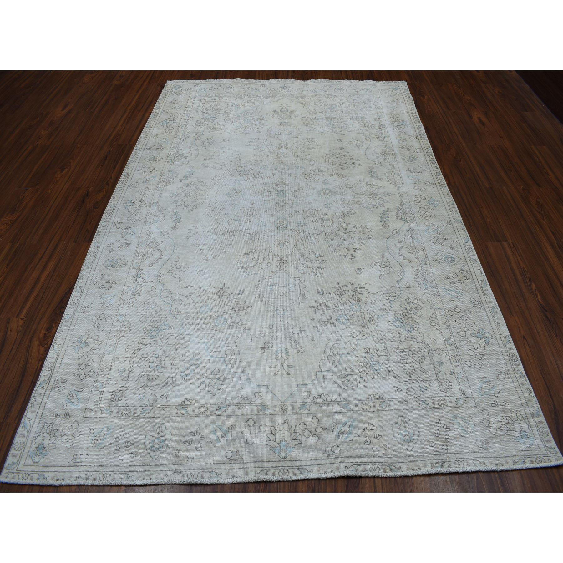 This is a truly genuine one-of-a-kind Vintage White Wash Tabriz Worn Wool Hand-Knotted Oriental Rug. It has been Knotted for months and months in the centuries-old Persian weaving craftsmanship techniques by expert