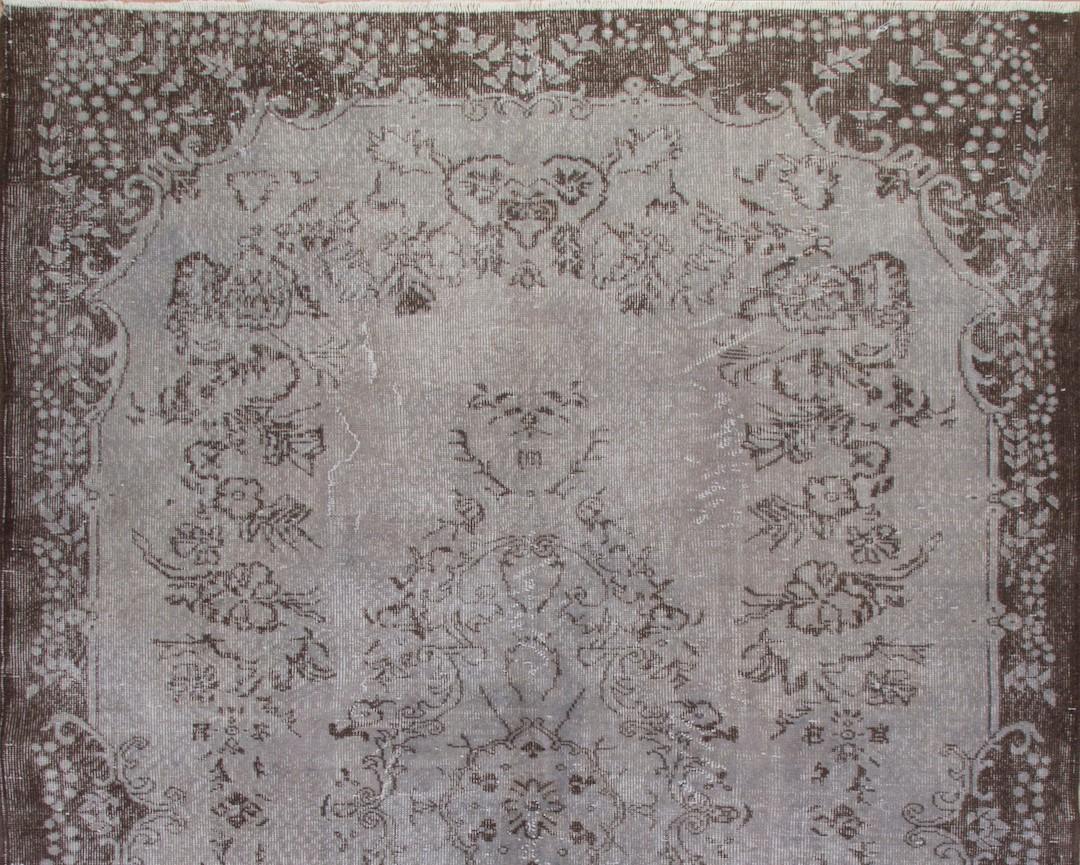A vintage hand-knotted Turkish area rug re-dyed in gray color.
Finely hand knotted, low wool pile on cotton foundation. Deep washed.
Sturdy and can be used on a high traffic area, suitable for both residential and commercial interiors.