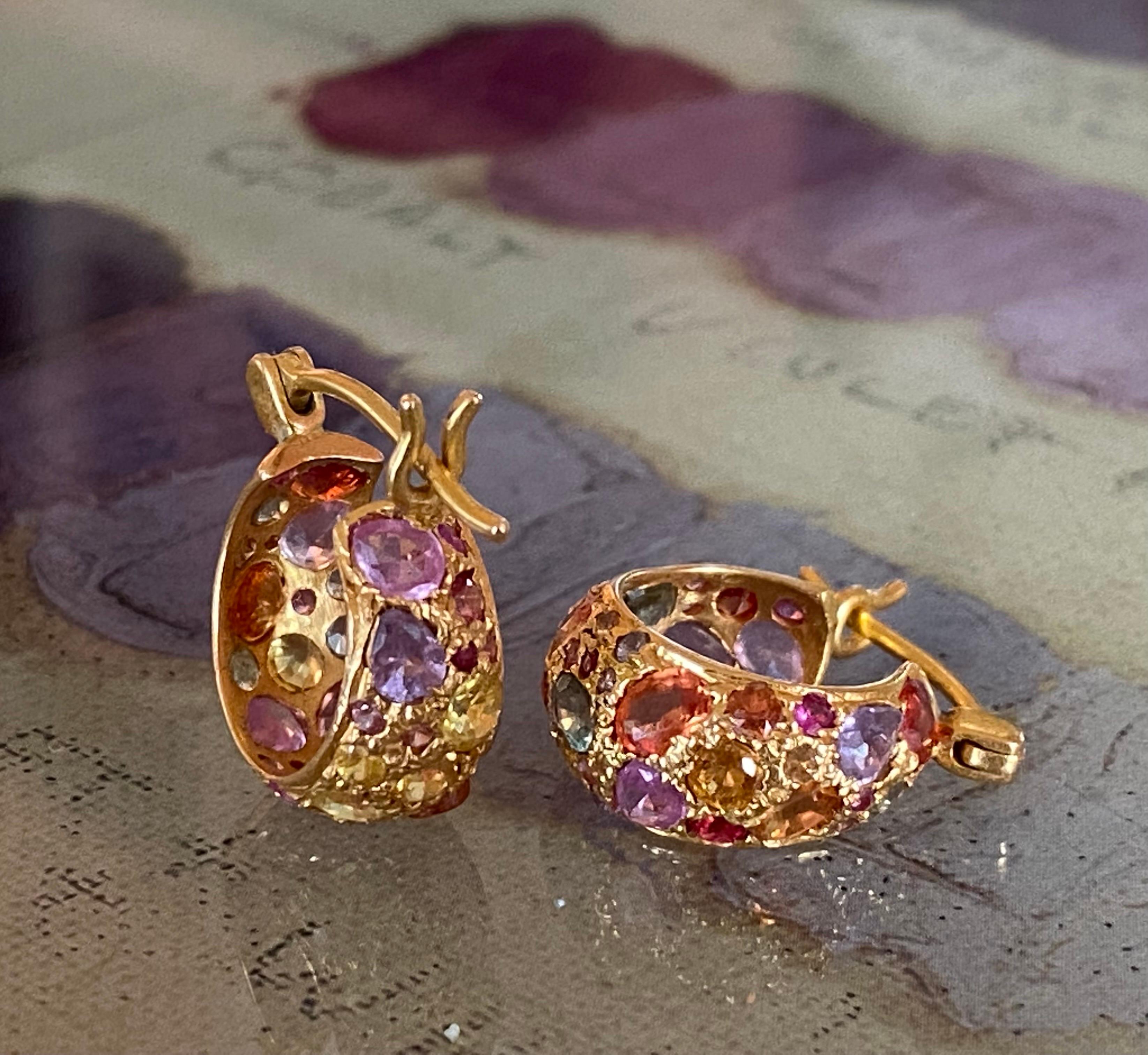 Designed by award winning jewelry designer, Lauren Harper, these multicolor sapphire and 18kt Gold hoops will become your favorite go to earring! Lightweight and secure on the ear, the variety of colors make these hoops the perfect to complete every