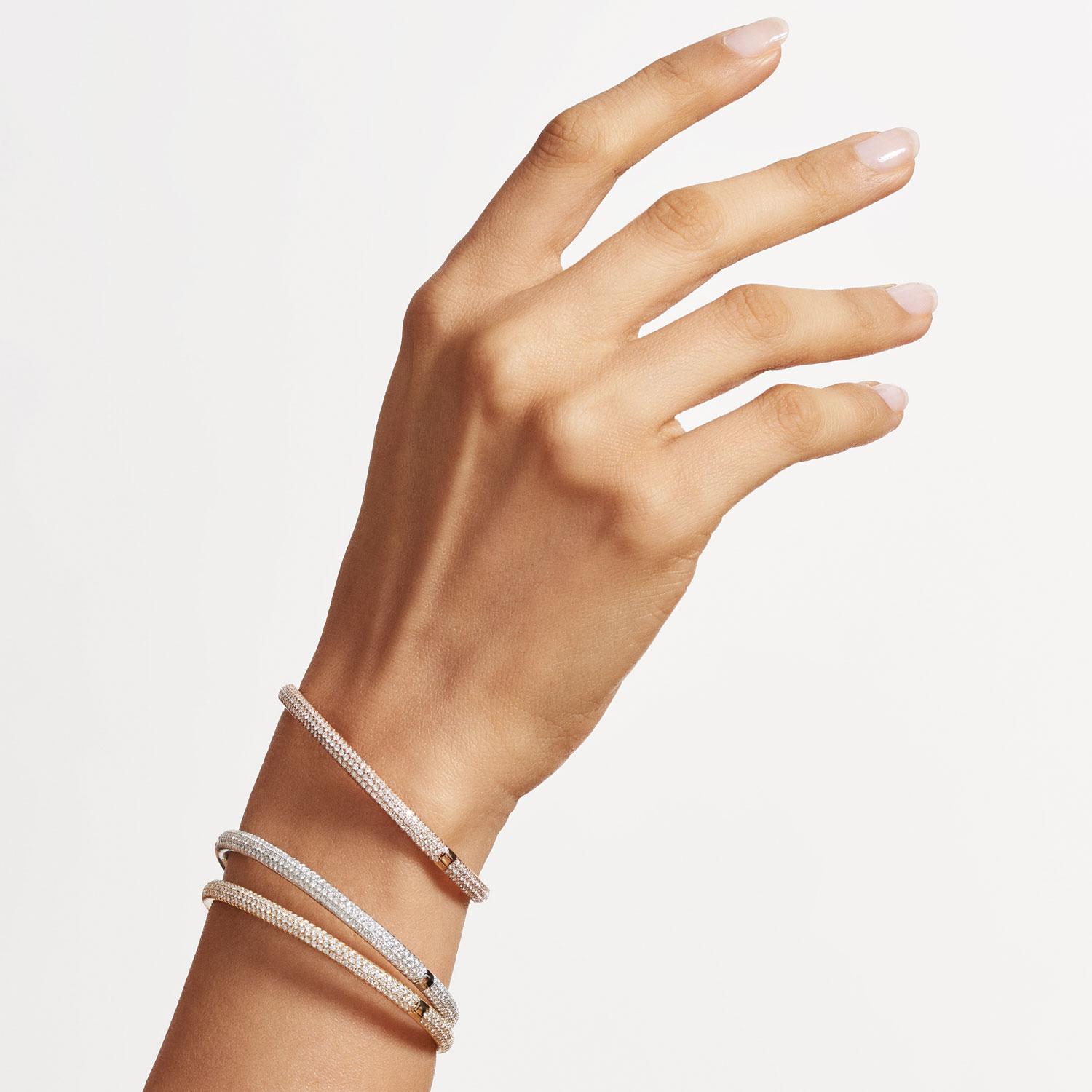 Simple, versatile and sleek, this set of Oval Pavé Bangles in three tones of gold are perfect for any occasion. 

On each bangle, each brilliant cut diamond is cut and set by hand in a micro-pavé finish. Designed in an oval shape with a custom pavé