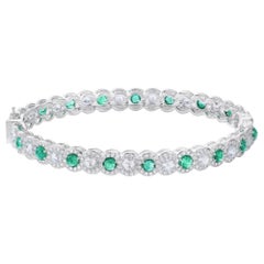 64 Facets Elements Emerald and Diamond Bangle in 18 Karat White Gold, 6.15 Carat