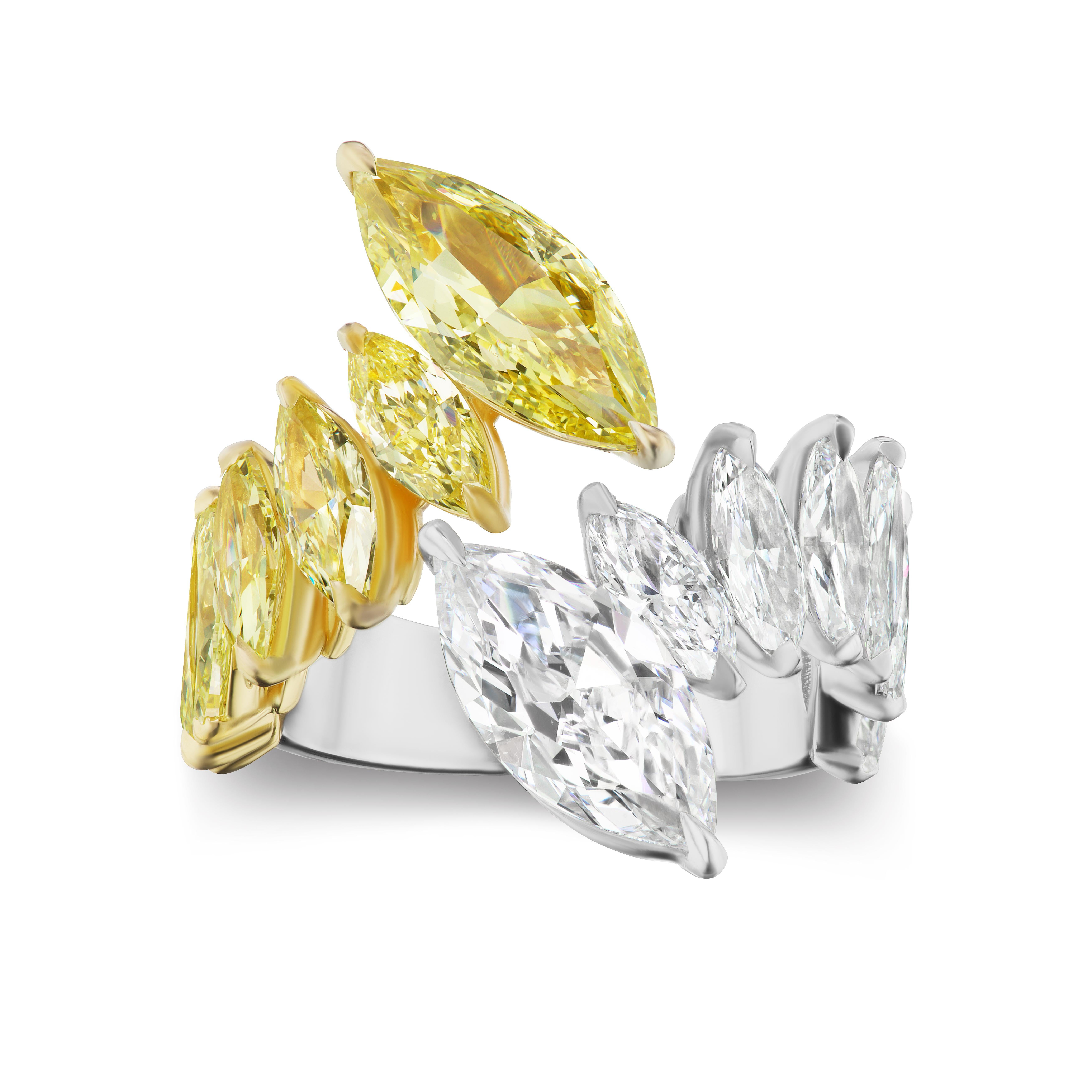 Marquise Shape White and Yellow Diamonds each weighing 2.0 and 2.50 carats respectively.
Set with White and Yellow Marquise Shaped Diamonds weighing 2.40 carats.
Set in Platinum and 18 Karat Rose Gold.