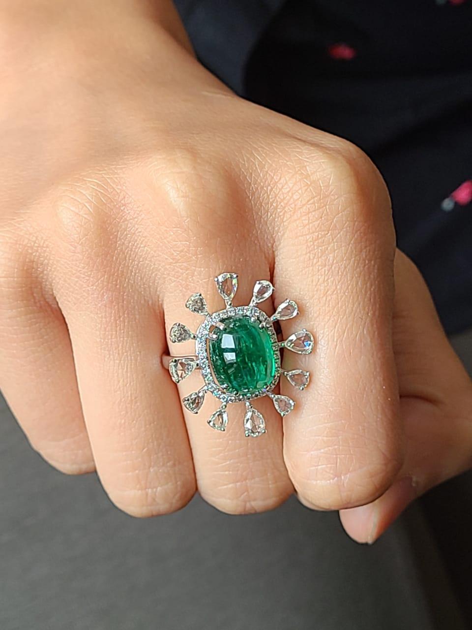 A beautiful cocktail ring set in 18k white gold set with natural emerald and diamond. The emerald weight is 6.40 carats and diamond weight is 1.48 carats. The net gold weight is 6.109 grams and ring dimensions in cm 2.5 x 2.5 x 2.5 (LXWXH). US size