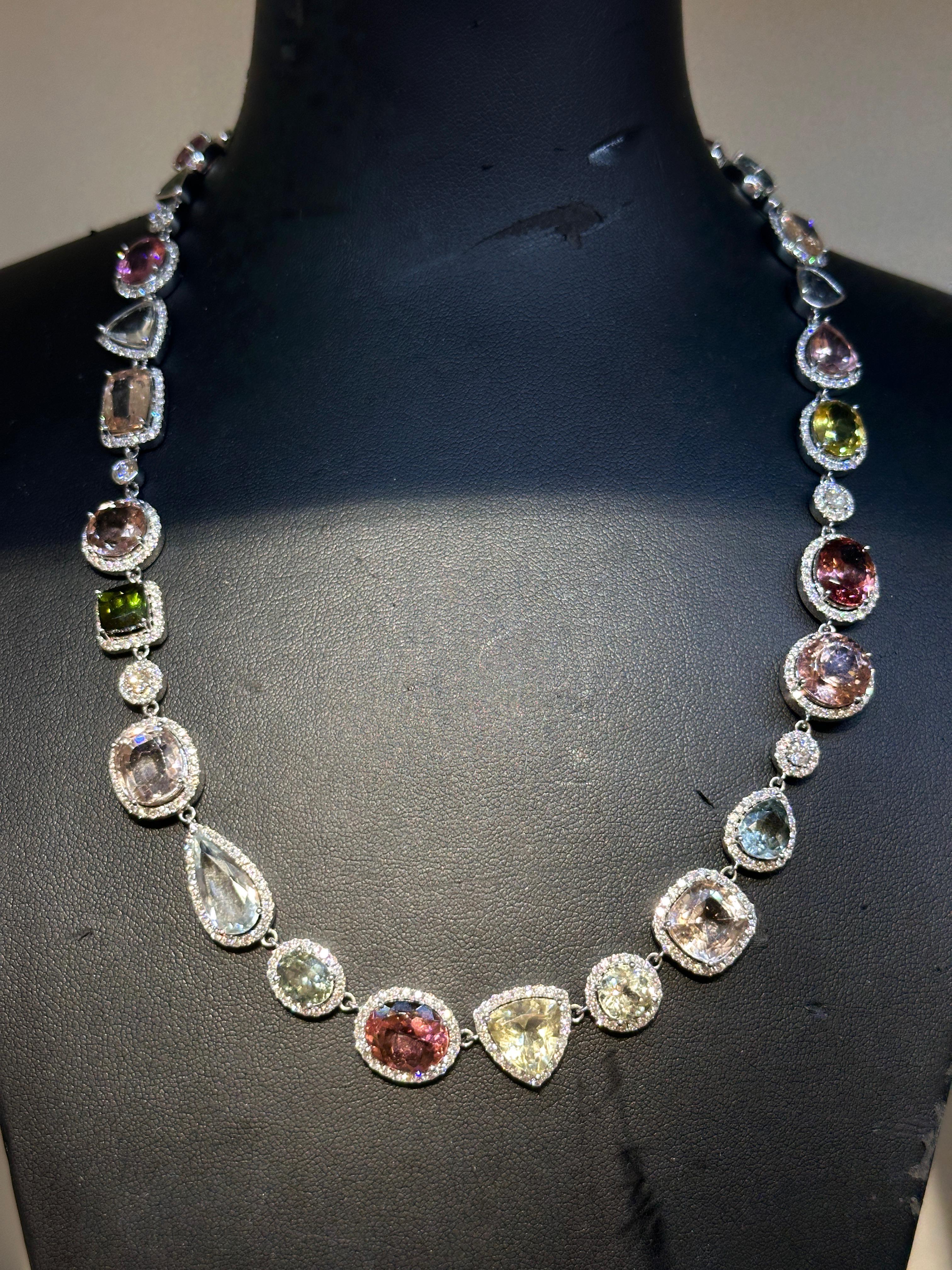 An extraordinary blend of color, craftsmanship, and elegance, this luxury tourmaline and diamond necklace is a rare statement of artistry and refinement. Featuring a remarkable 64.14 carats of natural multi-color tourmalines, each gemstone is