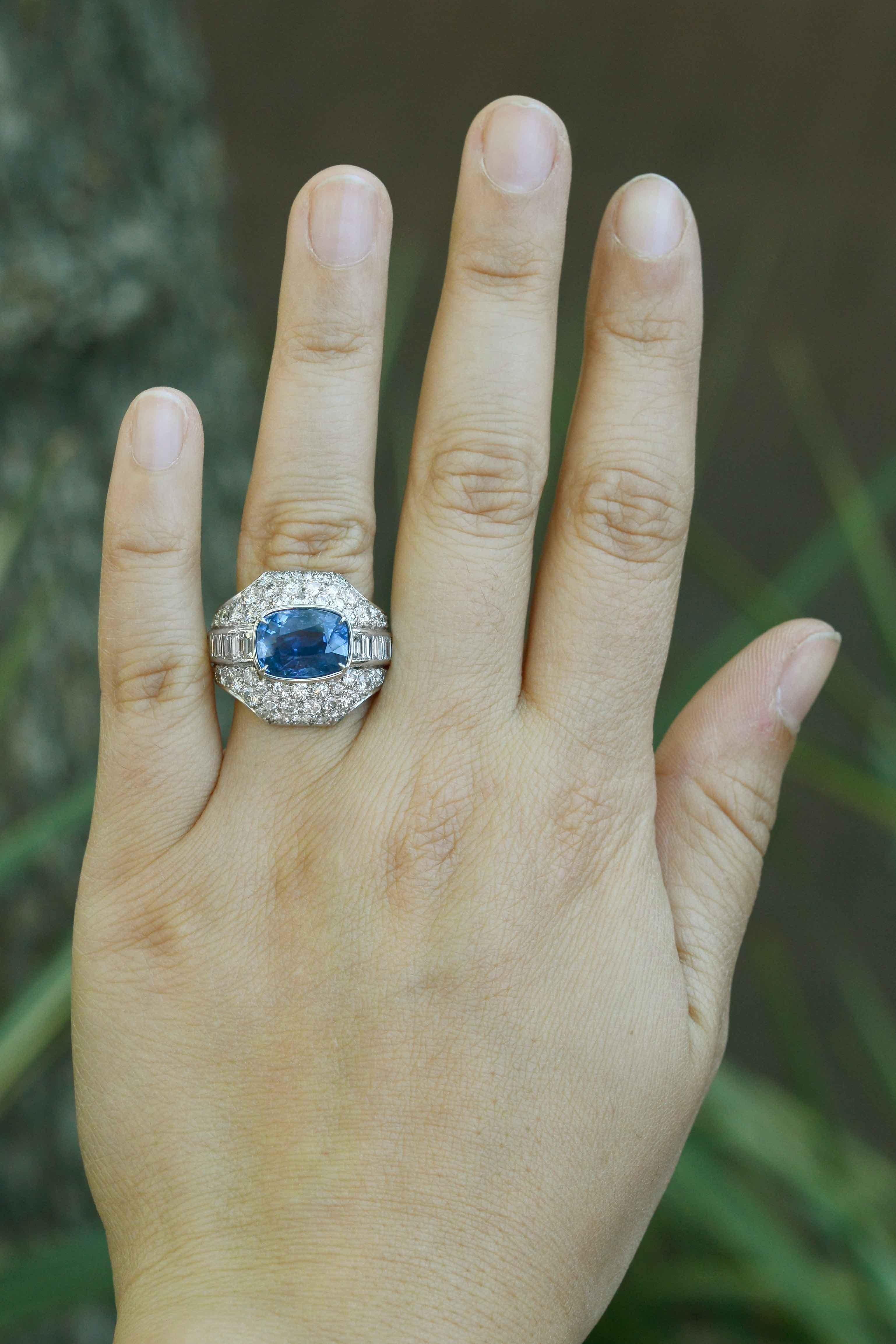 A stellar, no heated sapphire settled in a bed of glimmering diamonds. A gemstone this rare is unprecedented and highly coveted, especially one of this alluring, vivid color and saturation. The unique, bombe' dome cocktail ring setting provides an