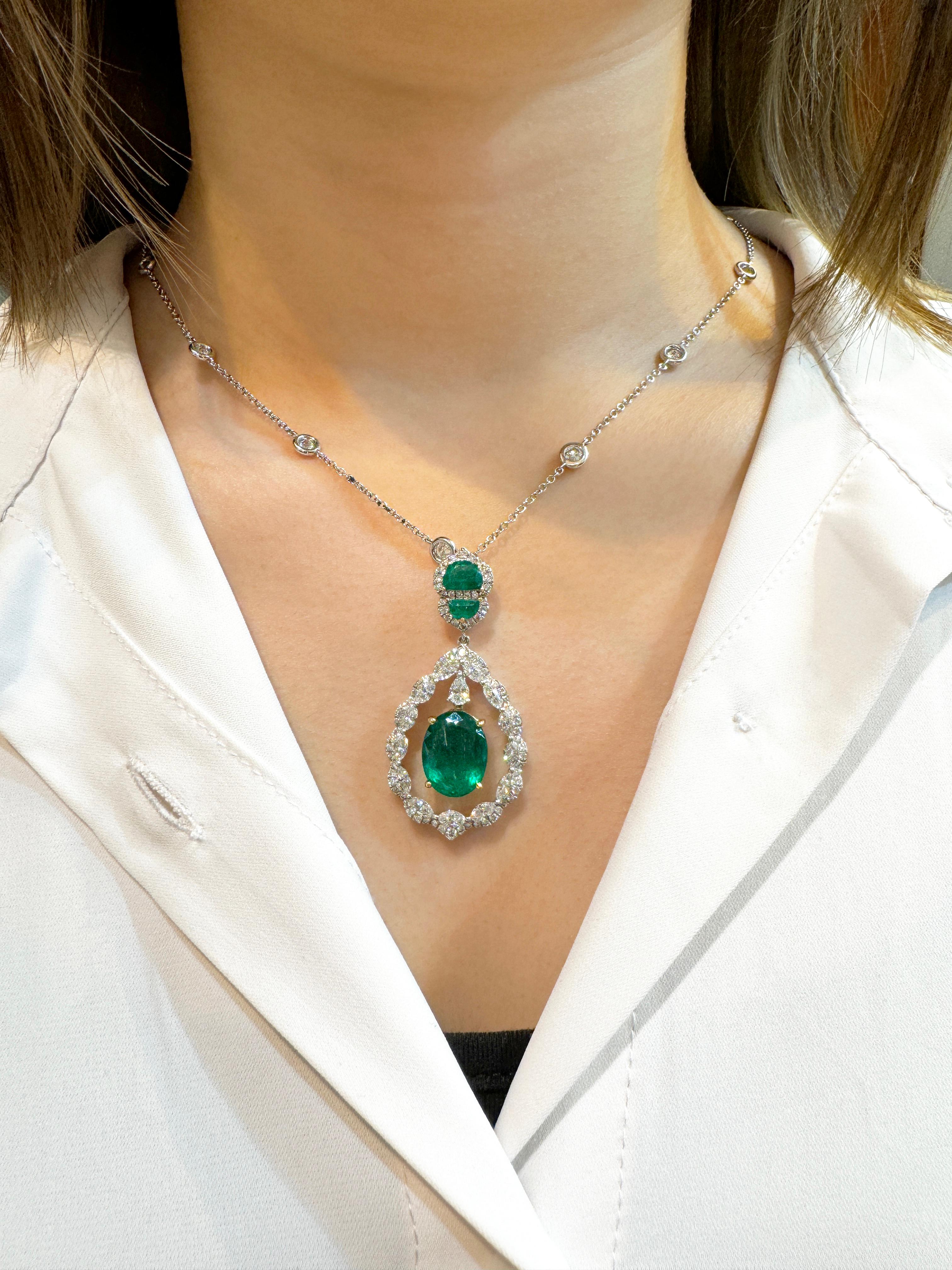 Oval Cut 6.42 Carat Floating Emerald with Diamond & Emeralds in 18K Pendant Necklace For Sale