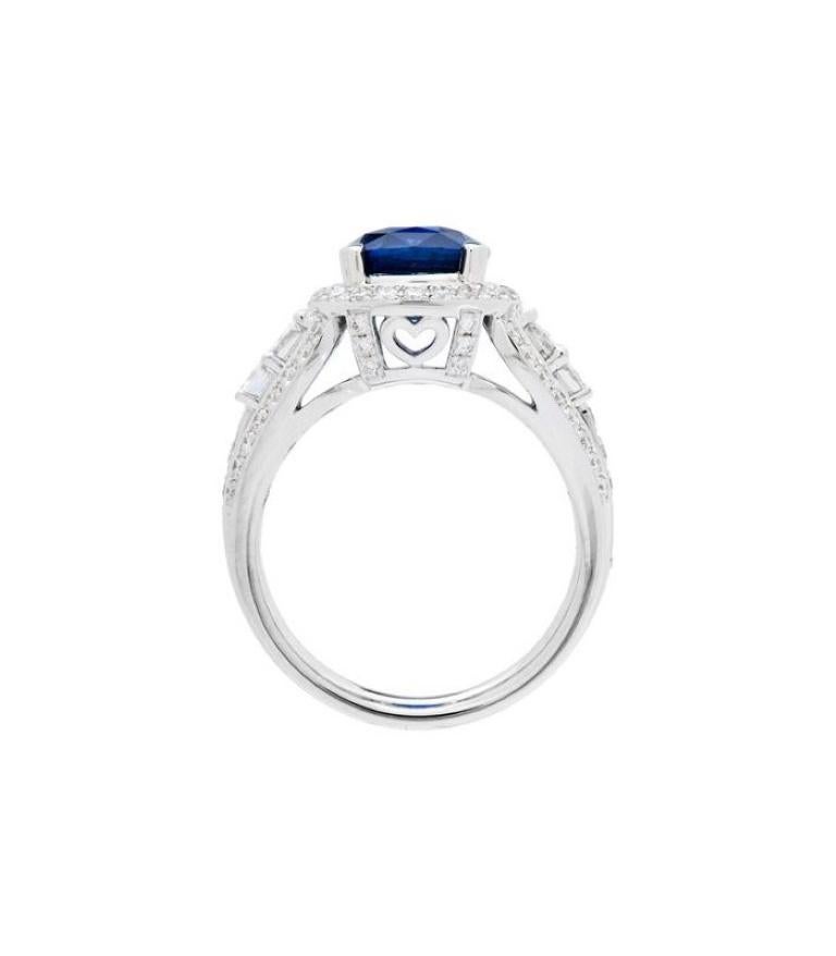One of a kind 6.43 Carat Cushion Cut Ceylon Sapphire and Diamonds in Gold.

*RING* One exclusive AMORO eighteen karat white gold blue Ceylon Sapphire and Diamond ring featuring; one heart prong set cushion cut genuine Ceylon Sapphire weighing