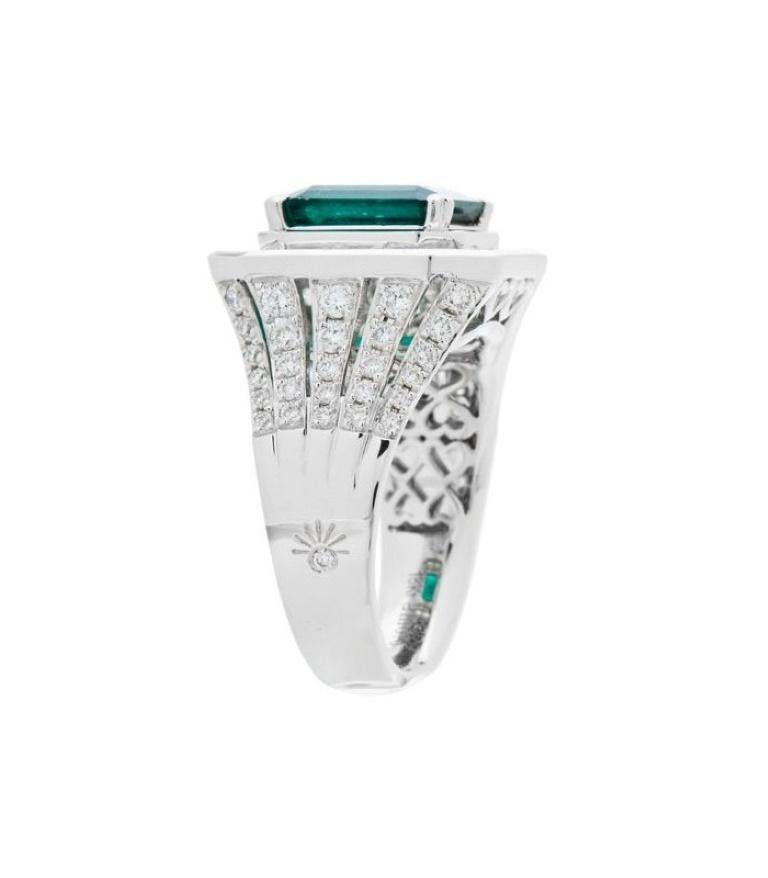 One of a kind 6.43 Carat Emerald Cut Colombian Emerald and Diamonds in Gold.

*RING* One (1) eighteen karat (18kt) white gold Colombian Emerald and Diamond ring featuring; one heart prong set emerald cut genuine Colombian Emerald weighing