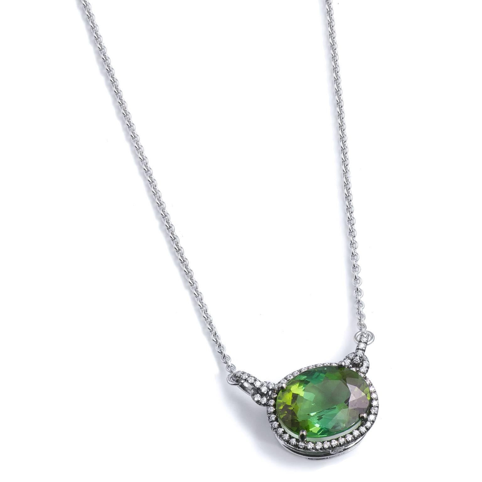 6.43 Carat Green Tourmaline and Diamond Pendant Necklace in 18 karat Gold

This is a handmade, one of a kind creation by H&H Jewels.  

It features a 6.43 carat of tourmaline surrounded by 0.25 carats of pave set diamond (F/VS) creating a halo.
 