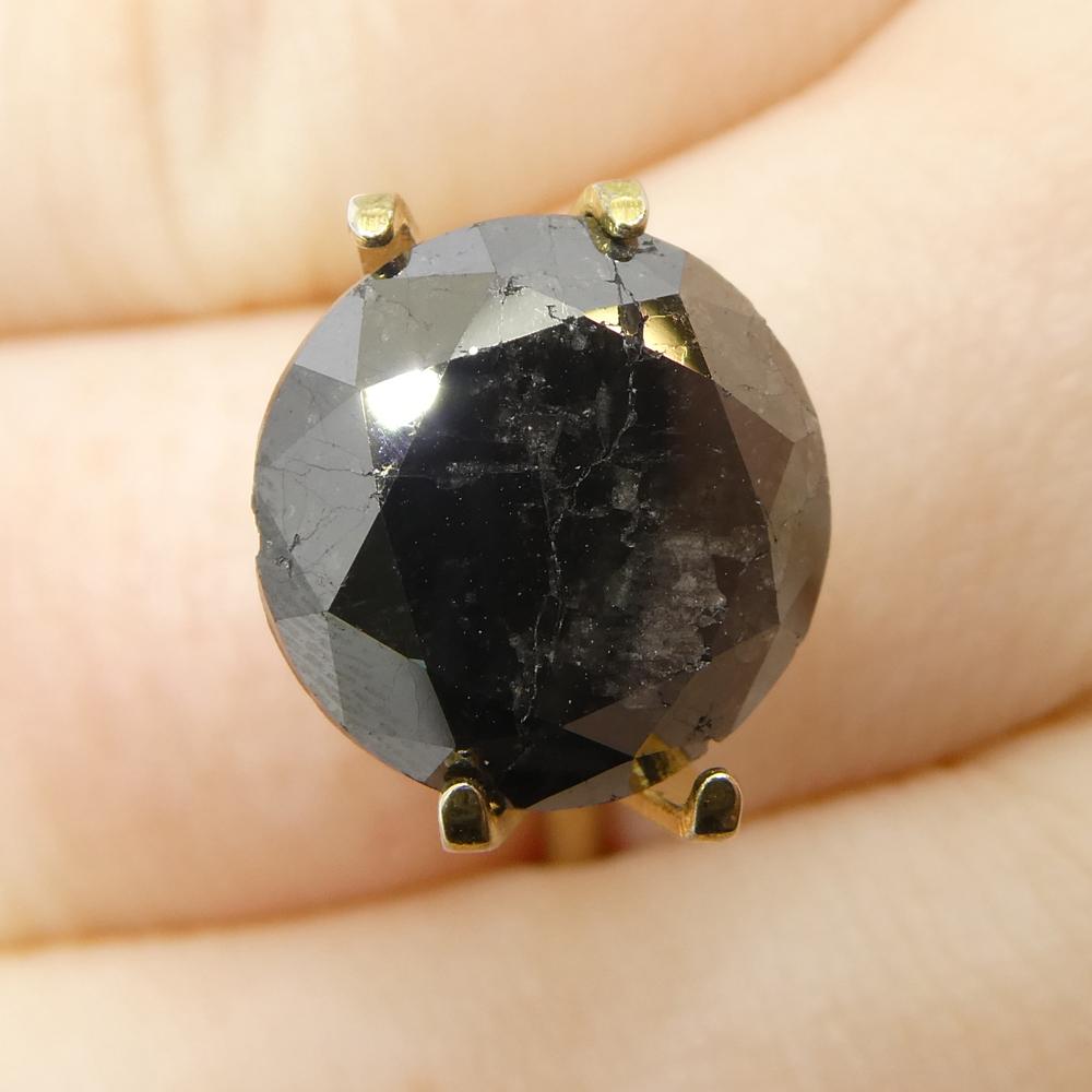 Description:

Gem Type: Diamond 
Number of Stones: 1
Weight: 6.43 cts
Measurements: 11.58 x 11.58 x 6.69 mm
Shape: Round
Cutting Style Crown: Brilliant Cut
Cutting Style Pavilion: Brilliant Cut 
Transparency: Opaque
Clarity: N/A
Colour: Black
Hue:
