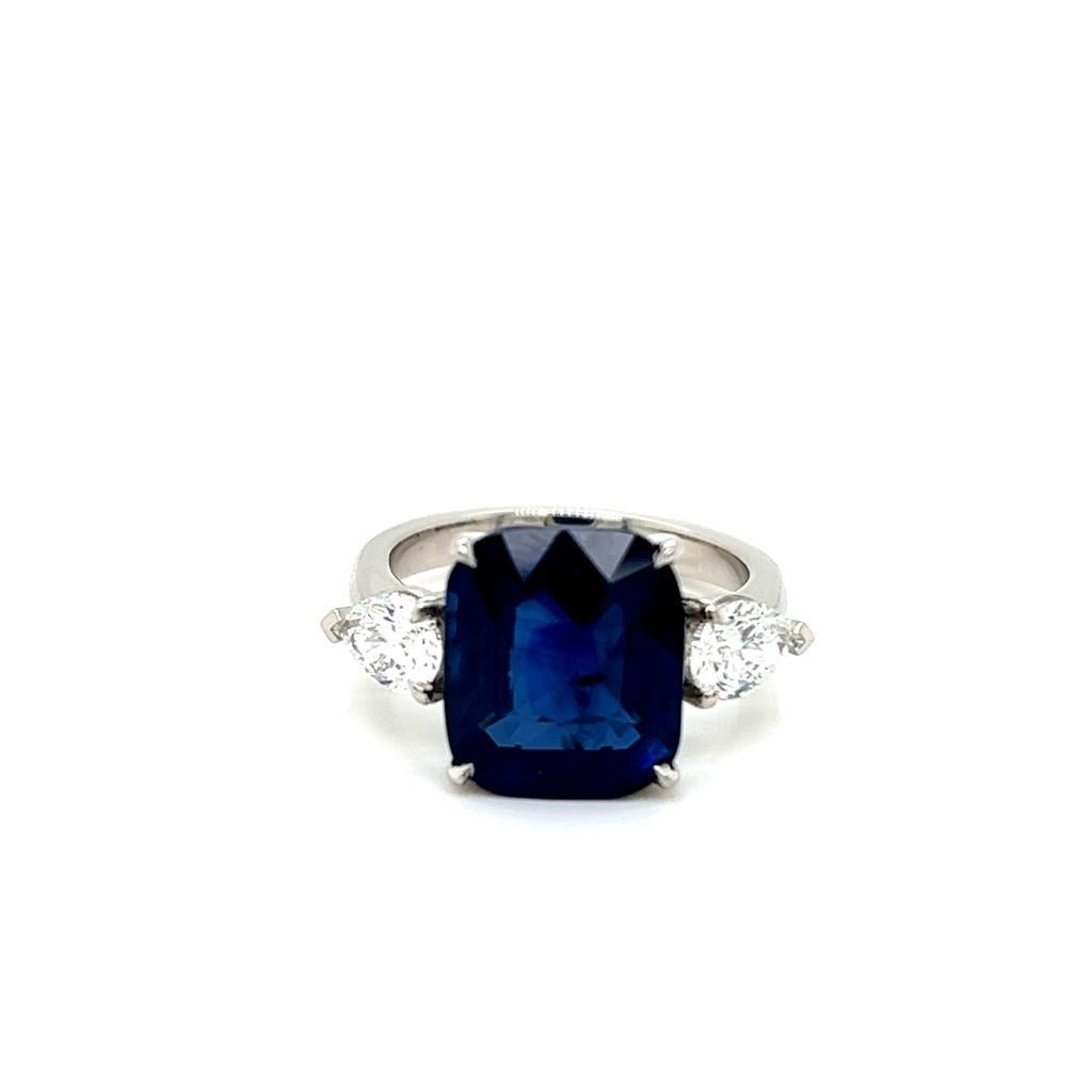 6.44 Carat Cushion cut Blue Sapphire and Diamond Three-Stone Platinum Ring.

This stunning ring features a magnificent 6.44 carat Blue Sapphire at its centre, with a pear-shaped Diamond on either side of it, held in a claw setting on a Platinum