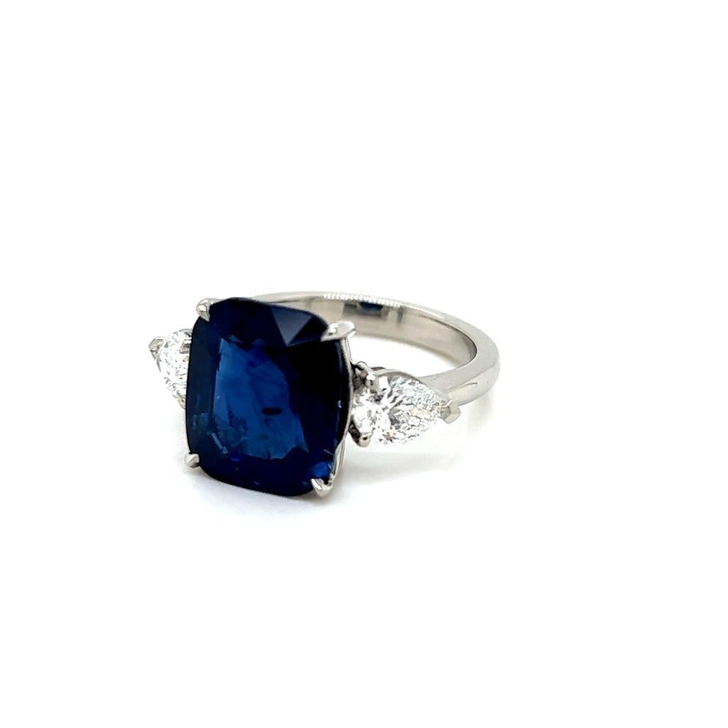 Contemporary 6.44 Carat Cushion cut Blue Sapphire and Diamond Three-Stone Platinum Ring For Sale