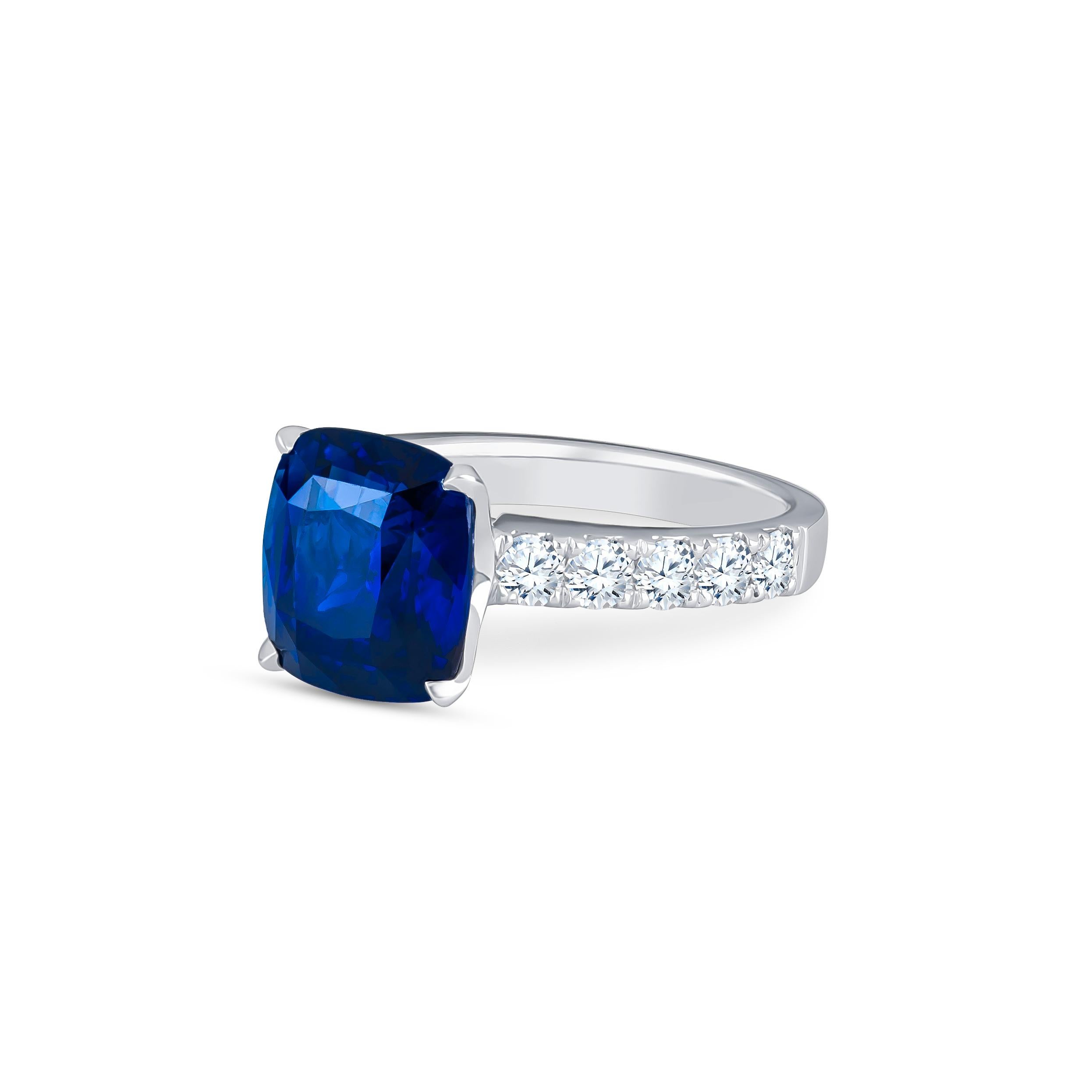 6.44 Carat vivid blue Sri Lanka sapphire (GRS certified) with 0.96 carats total weight of round brilliant prong set diamonds, set in 18k white gold. Ring size 6.5, size may be resize-able to larger or smaller upon request.

Natural sapphire