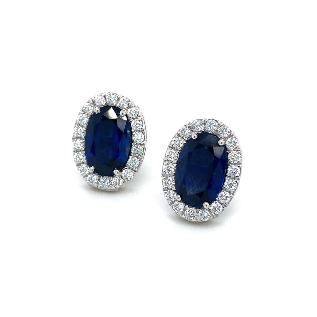 Oval Cut 6.45 Carat Natural Blue Sapphire studs with Diamond halo For Sale