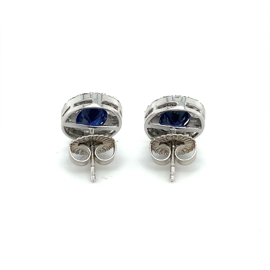 Women's 6.45 Carat Natural Blue Sapphire studs with Diamond halo For Sale