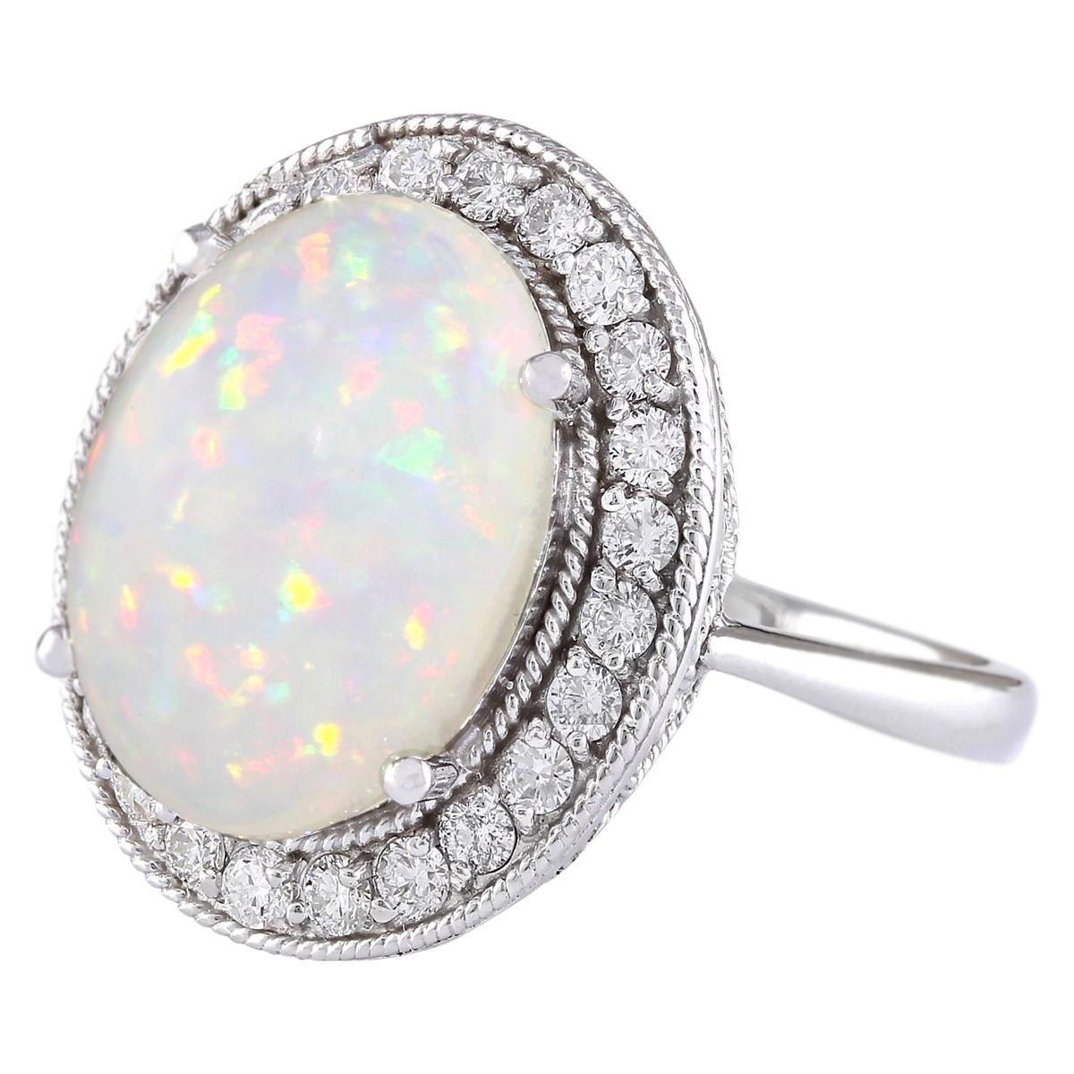 6.45 Carat Natural Opal 14 Karat White Gold Diamond Ring
Stamped: 14K White Gold
Total Ring Weight: 7.8 Grams
Total Natural Opal Weight is 5.75 Carat (Measures: 16.00x12.00 mm)
Color: Multicolor
Total Natural Diamond Weight is 0.70 Carat
Color: F-G,