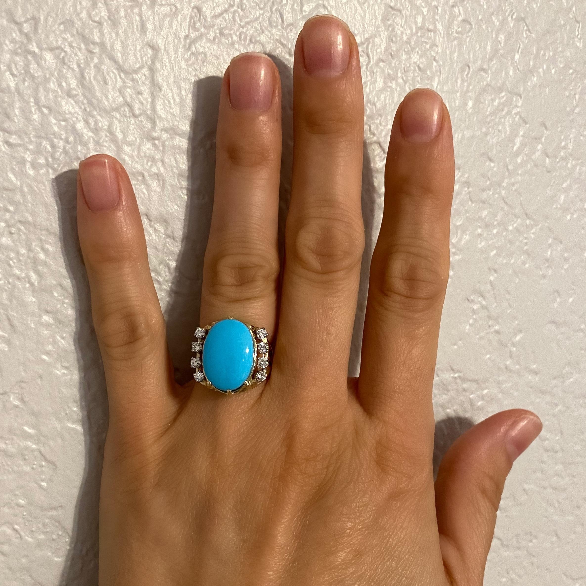 Simply Beautiful! Elegant and finely detailed Turquoise and Diamond Cocktail Ring center set with a securely nestled Oval Cabochon Turquoise weighing approx. 6.45 Carat, either side set with Diamonds. Hand crafted in 14 Karat yellow Gold. Dimensions