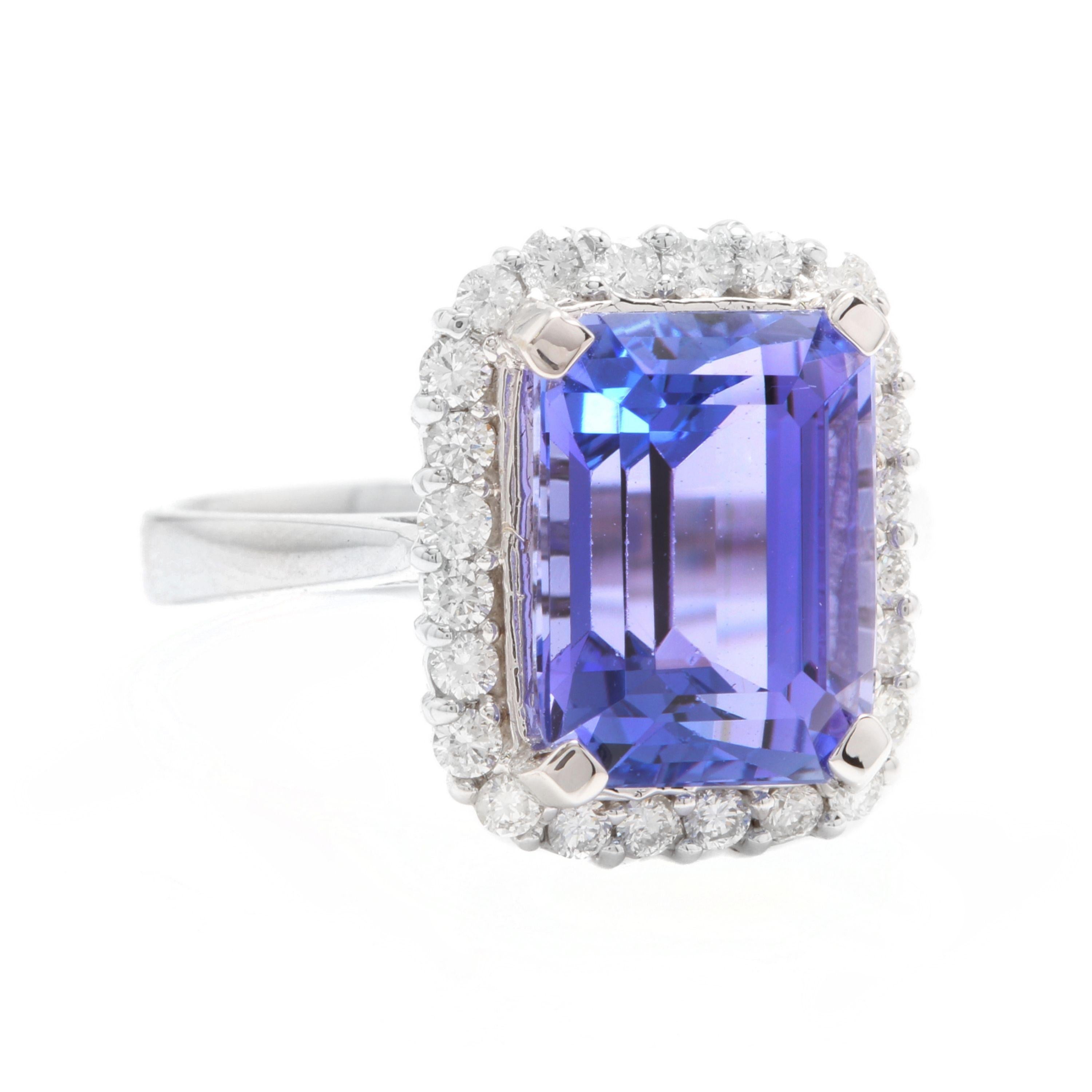 6.45 Carats Natural Very Nice Looking Tanzanite and Diamond 14K Solid White Gold Ring

Total Natural Emerald Cut Tanzanite Weight is: Approx. 6.00 Carats

Tanzanite Measures: Approx. 11.25 x 8.50mm

Natural Round Diamonds Weight: Approx. 0.45 Carats