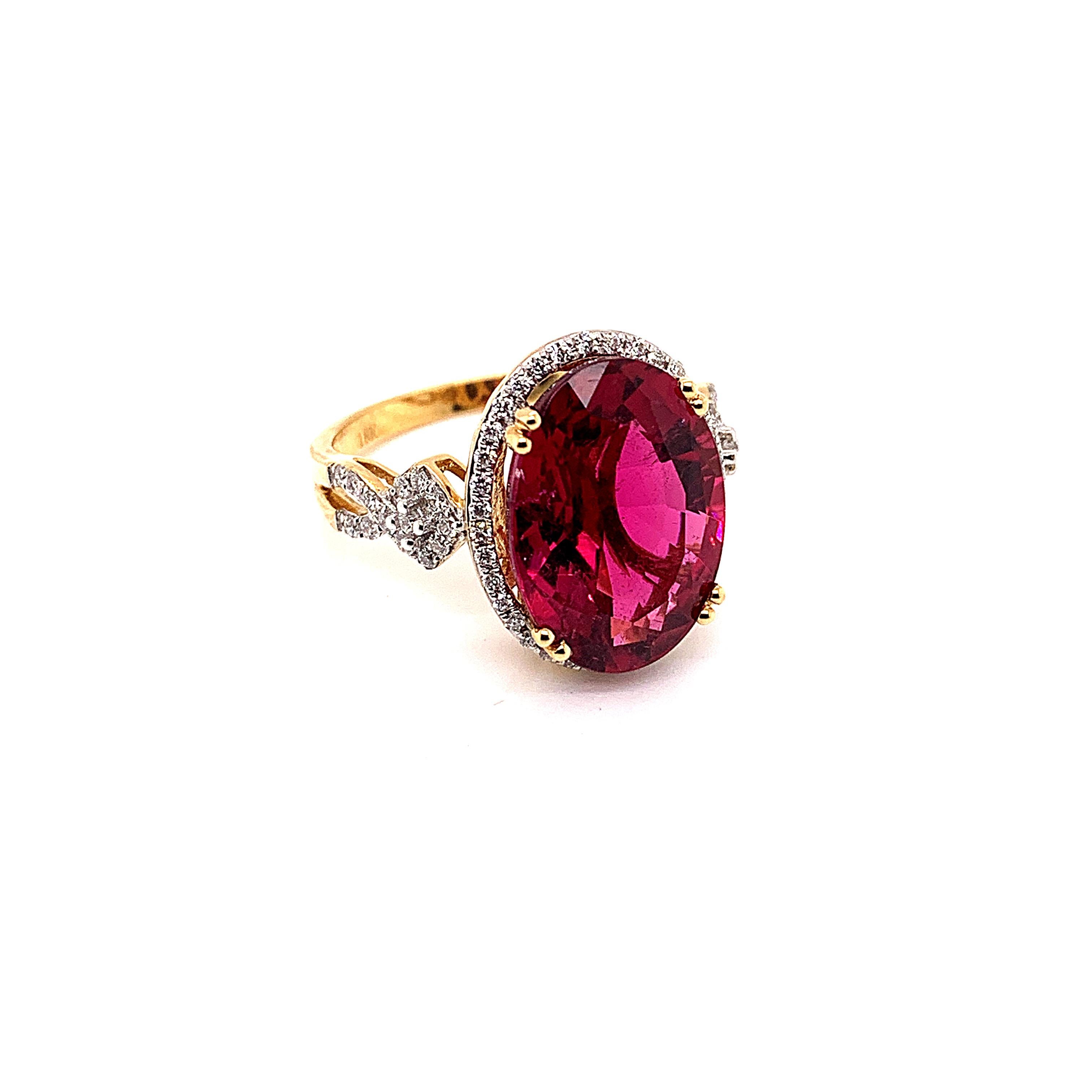 Oval Cut 6.46 Carat Oval Shaped Rubelite Ring in 18 Karat Yellow Gold with Diamonds For Sale