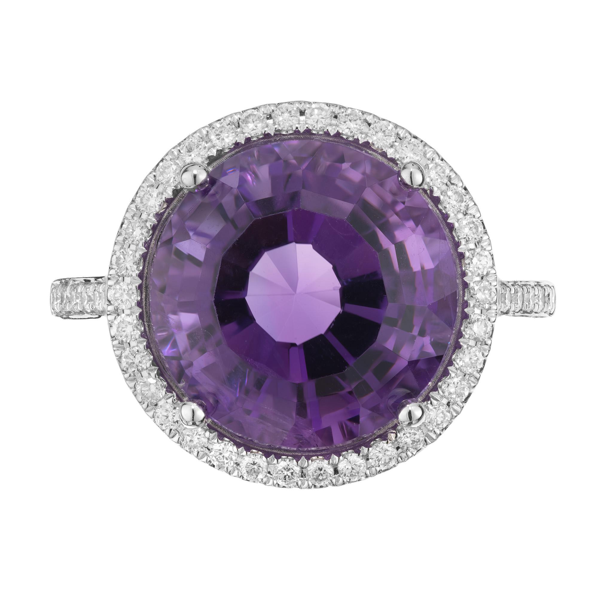 Indulge in elegance with our Amethyst and Diamond cocktail ring. This exquisite piece features a stunning 6.45ct round amethyst center stone mounted in a 14k white gold setting. The Amethyst is accented by a halo of round brilliant cut sparkling