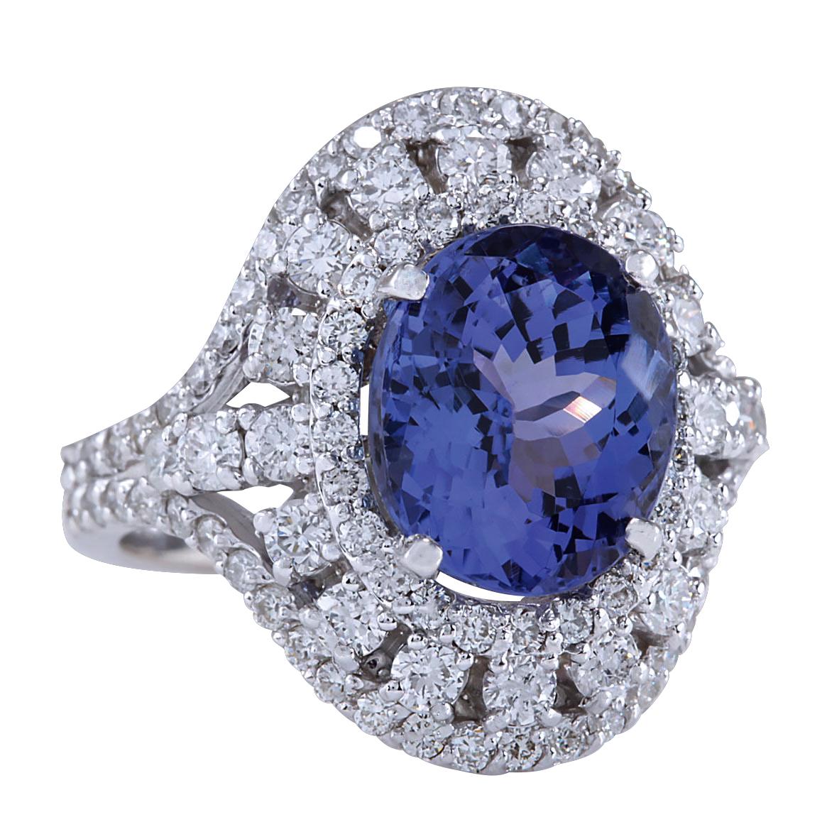 Introducing our magnificent 6.46 Carat Tanzanite 14 Karat White Gold Diamond Ring. Crafted from stamped 14K White Gold, this ring has a total weight of 8.0 grams, ensuring both quality and durability. The centerpiece is a stunning tanzanite gemstone
