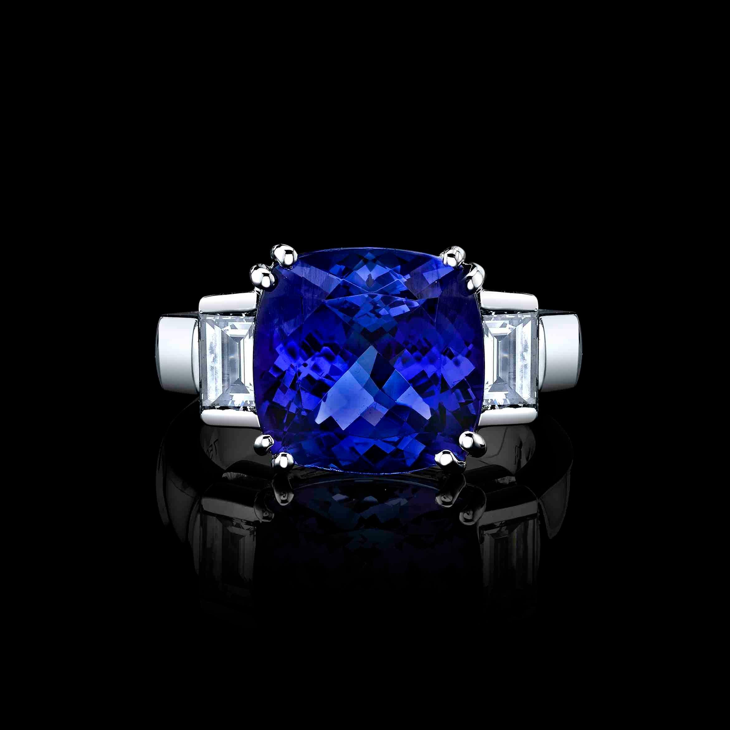 A beautiful 6.47ct Cushion Tanzanite set in 18K white gold ring with 2 side Diamond baguettes with a total weight of 1.02cttw