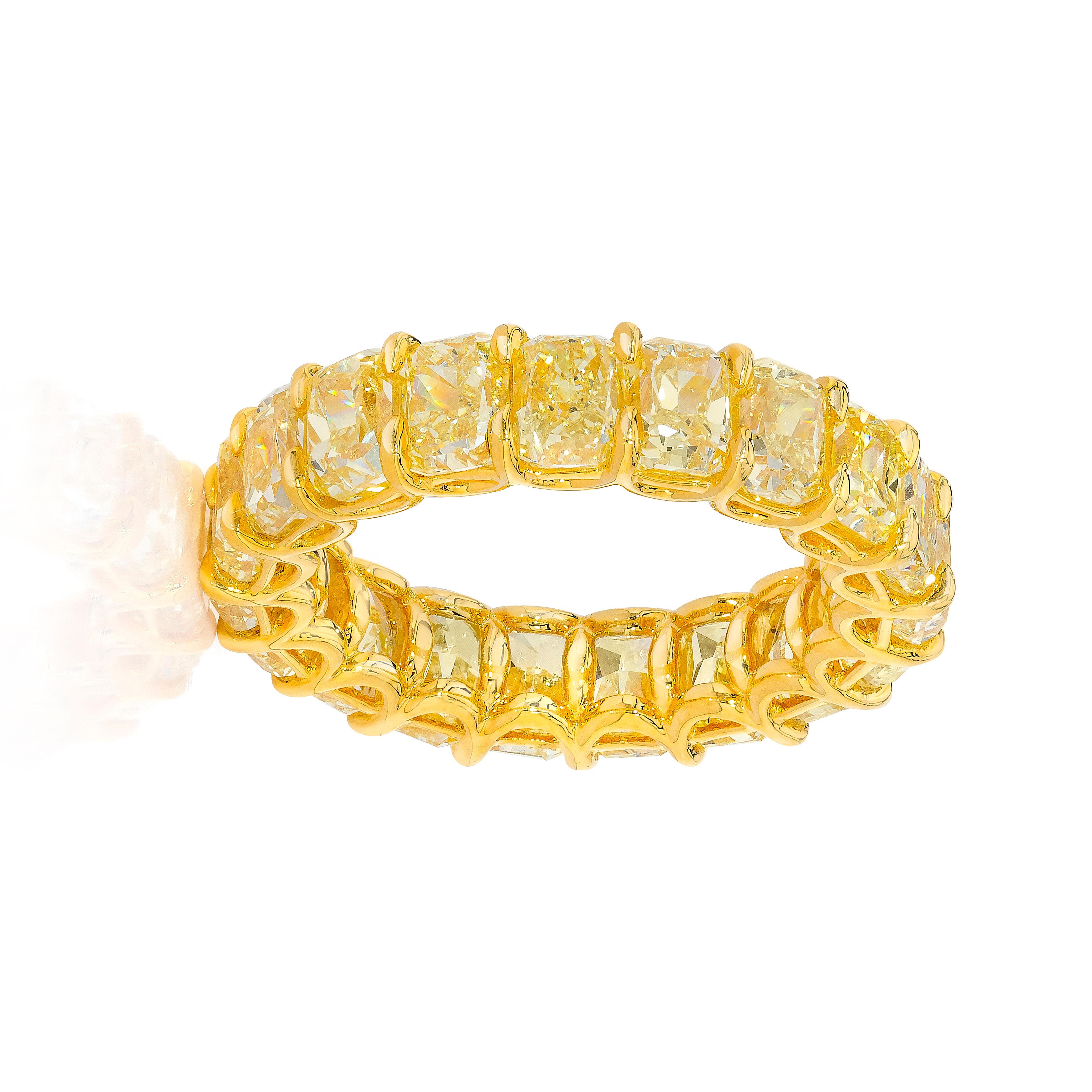 This Eternity Ring features 19 perfectly matched Cushion Cut Fancy Yellow Diamonds weighing 6.47 Carats. Each Stone weighs about 34 points.
Set in 18 Karat Yellow Gold.
Size 6.0