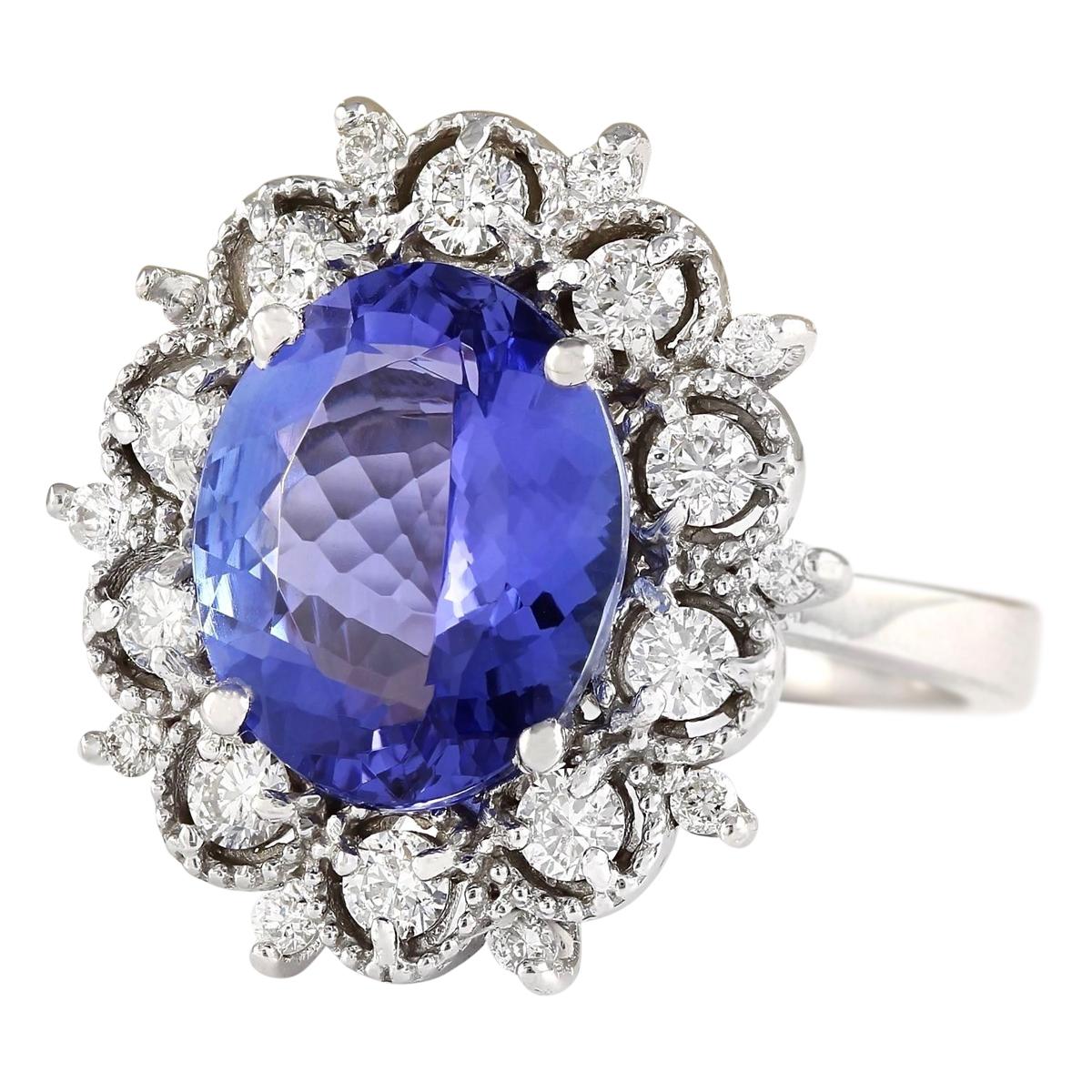Presenting our captivating 6.47 Carat Natural Tanzanite 14 Karat White Gold Diamond Ring, a masterpiece of luxury and elegance. Crafted from exquisite 14K white gold and stamped for authenticity, this ring is a symbol of sophistication. At its heart