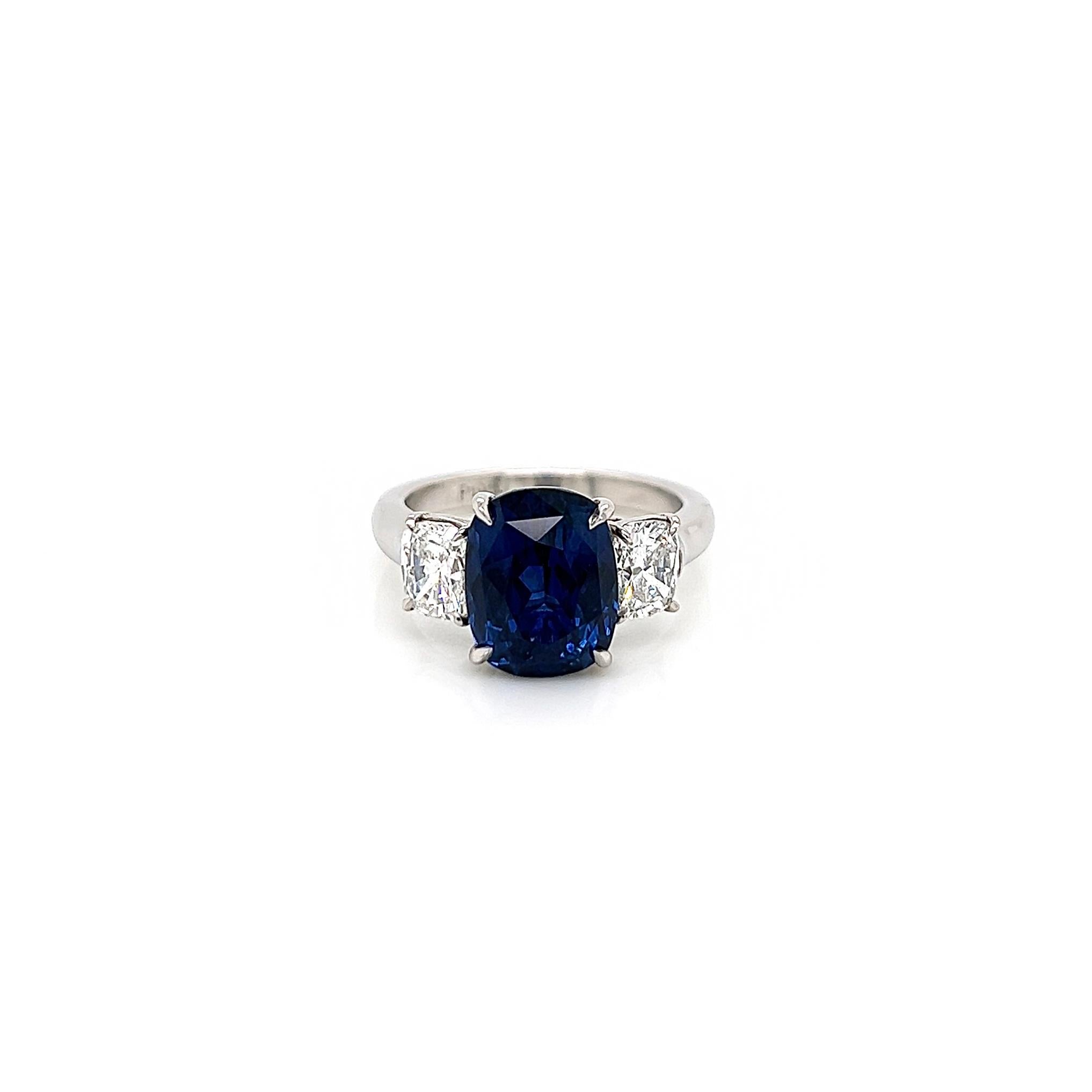 6.47 Total Carat Sapphire and Diamond Three Stone Ladies Ring 

-Metal Type: Platinum
-5.20 Carat Cushion Cut Natural Blue Sapphire
-1.27 Carat Cushion Cut Natural side Diamonds. F-G Color, VS1 Clarity 

-Size 6.25

Made in New York City.