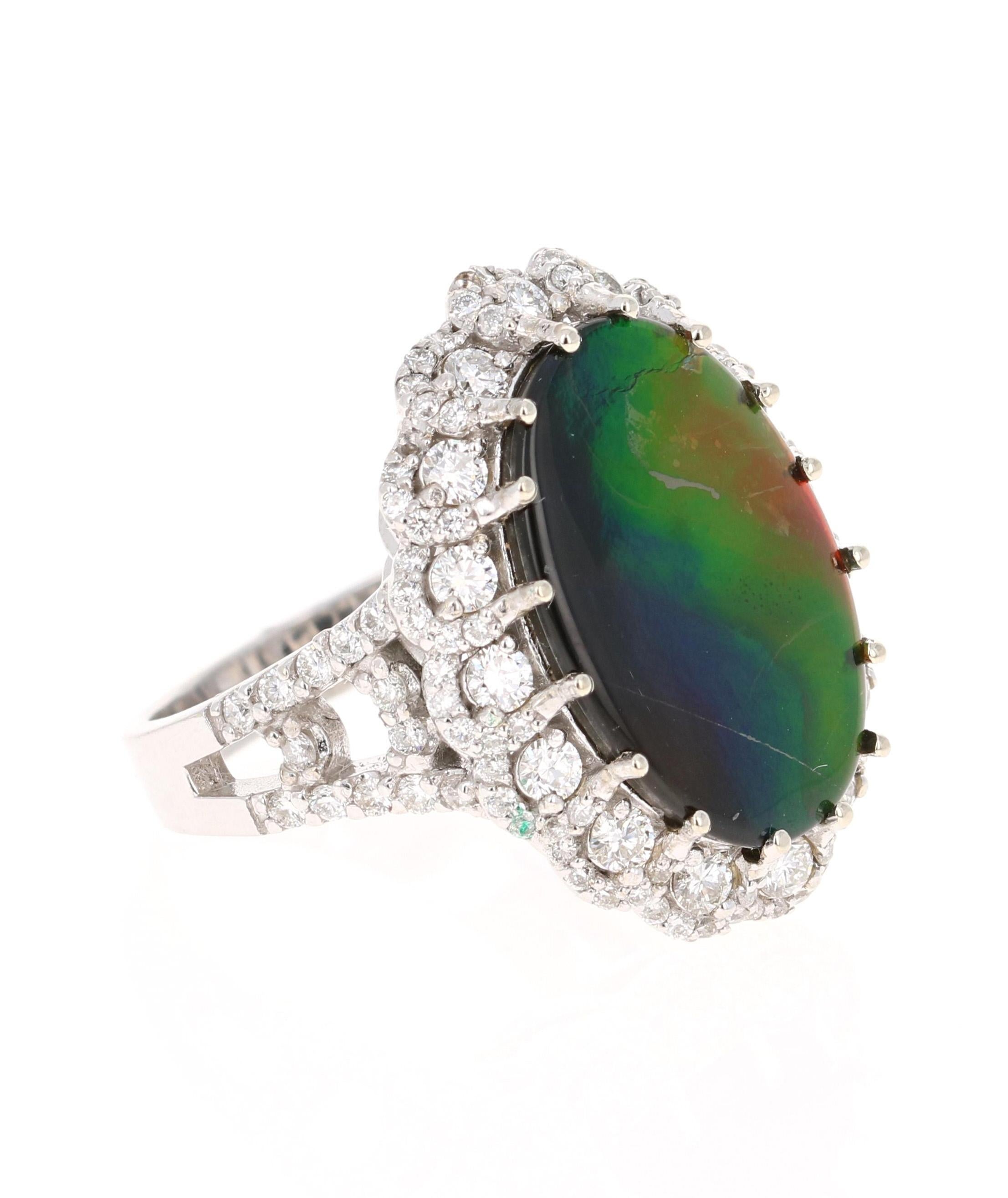 Rainbow Masterpiece! 

This unique ring has a 5.10 Carat Oval Cut Amolite.  Amolite is an Opal-like organic gemstone that is primarily found in the eastern slopes of the North American Rocky Mountains. The Amolite has hues of green, blue, yellow &