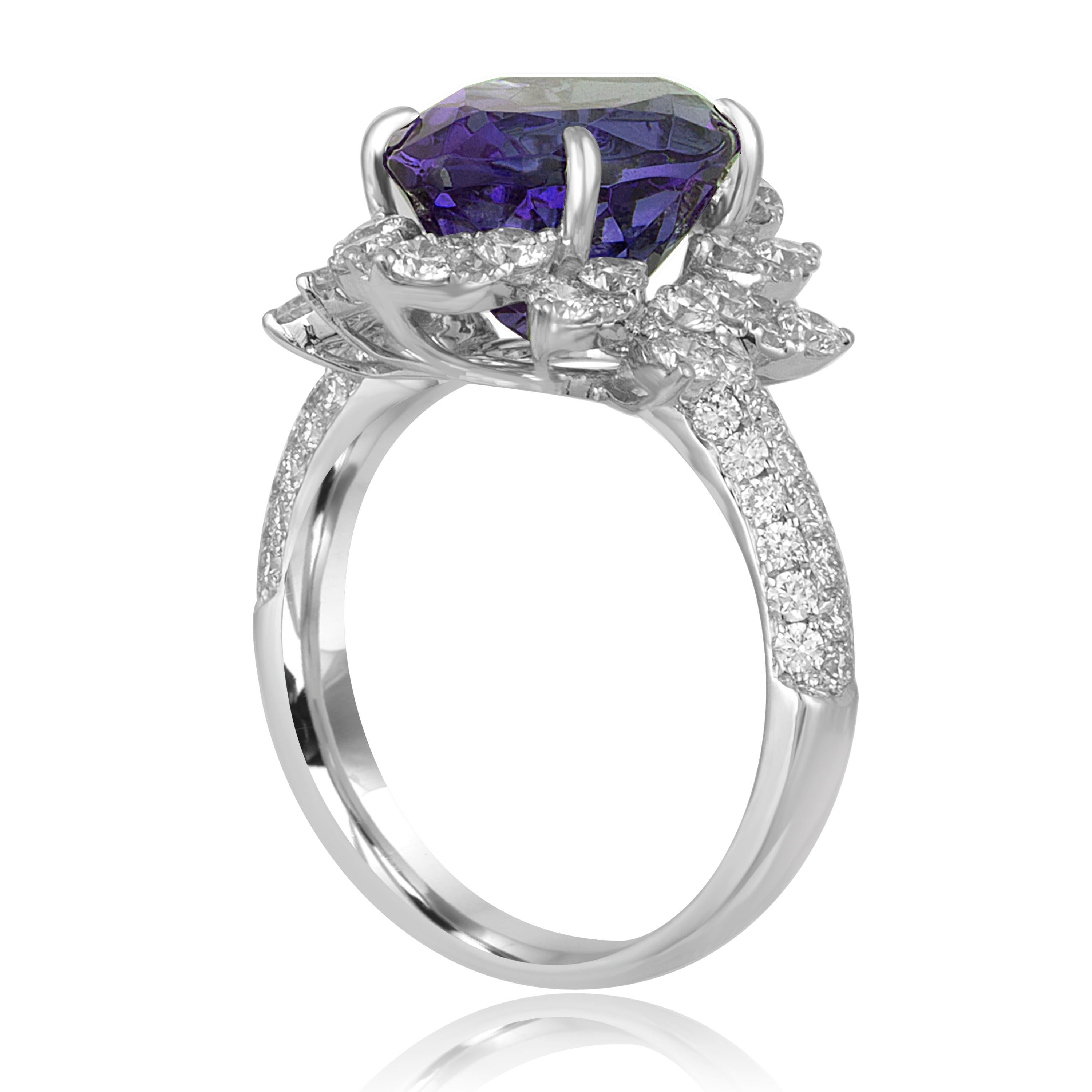 Huge & Stunning
The ring is 18K White Gold
There are 1.52 Carats in Diamonds F/G VS
The Tanzanite is 6.48 Carats Marquise Shape
The top portion measures 0.75