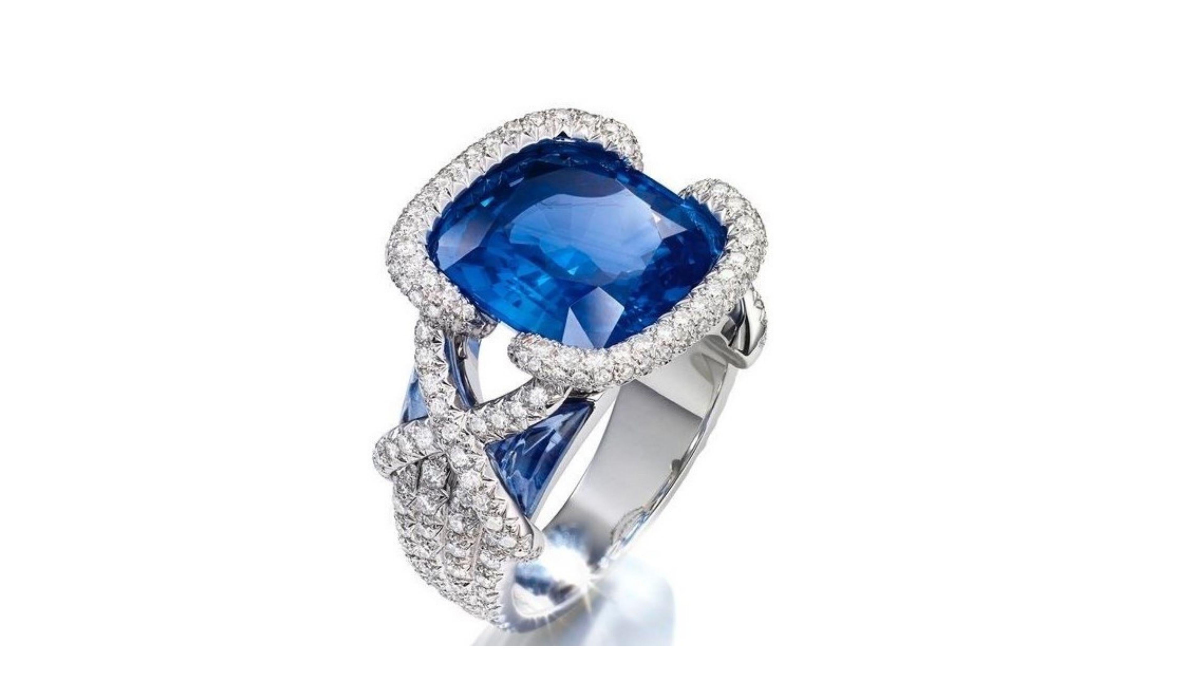 
6.48 Carat Tanzanite Ring in this unique design with 128 White Diamonds at 1.28 Carat making really stand out. Set in 18 Karat White Gold

 We have other tanzanite rings  too and you can have any custom made too