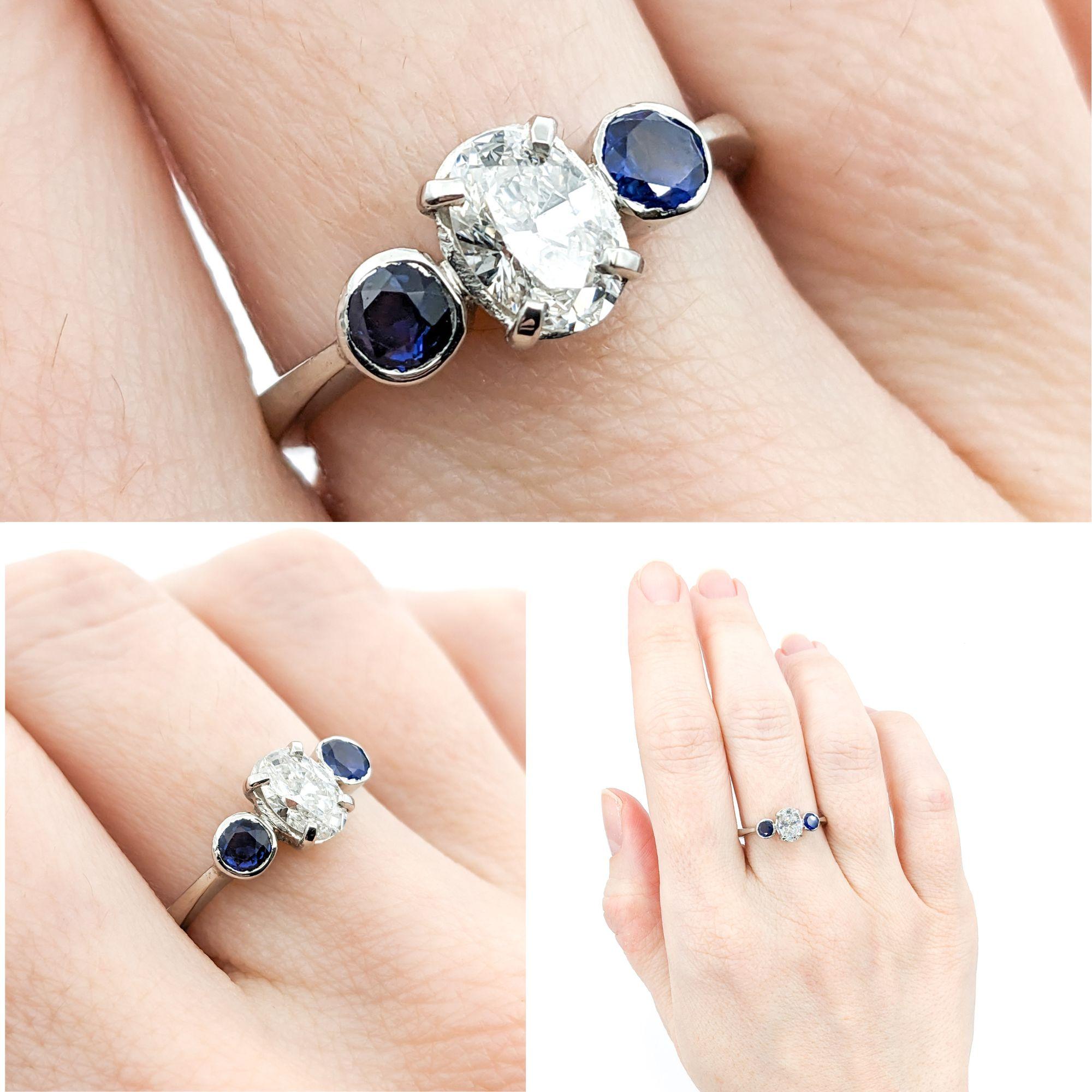 .64ct Diamond & Blue Sapphire Ring In Platinum

Discover elegance redefined with this stunning Natural Diamond and Sapphire Ring, exquisitely crafted in 950 Platinum. At the heart of this design lies a bright .64ct of oval diamond,  shimmering with