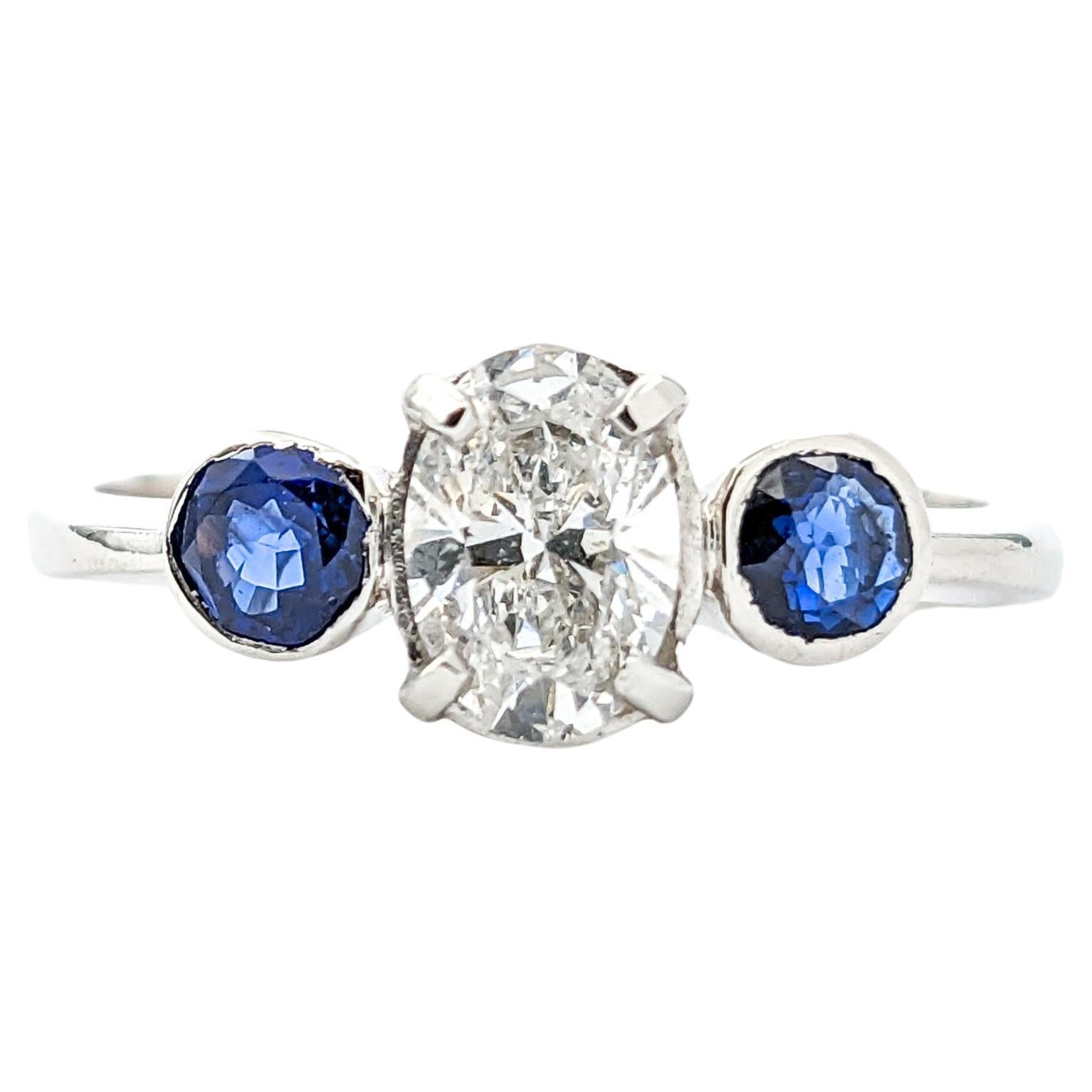 Anillo de platino con diamante y zafiro azul de 0,64 ct
