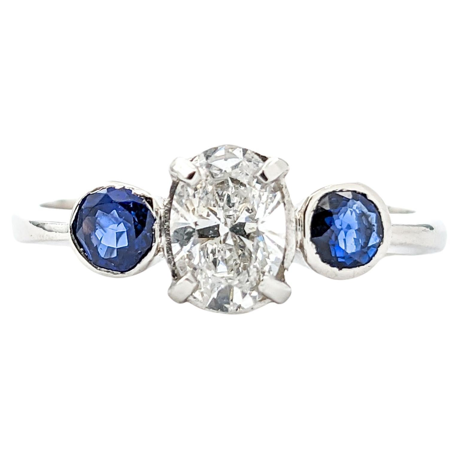 Bague en platine avec diamant de 0,64ct et saphir bleu