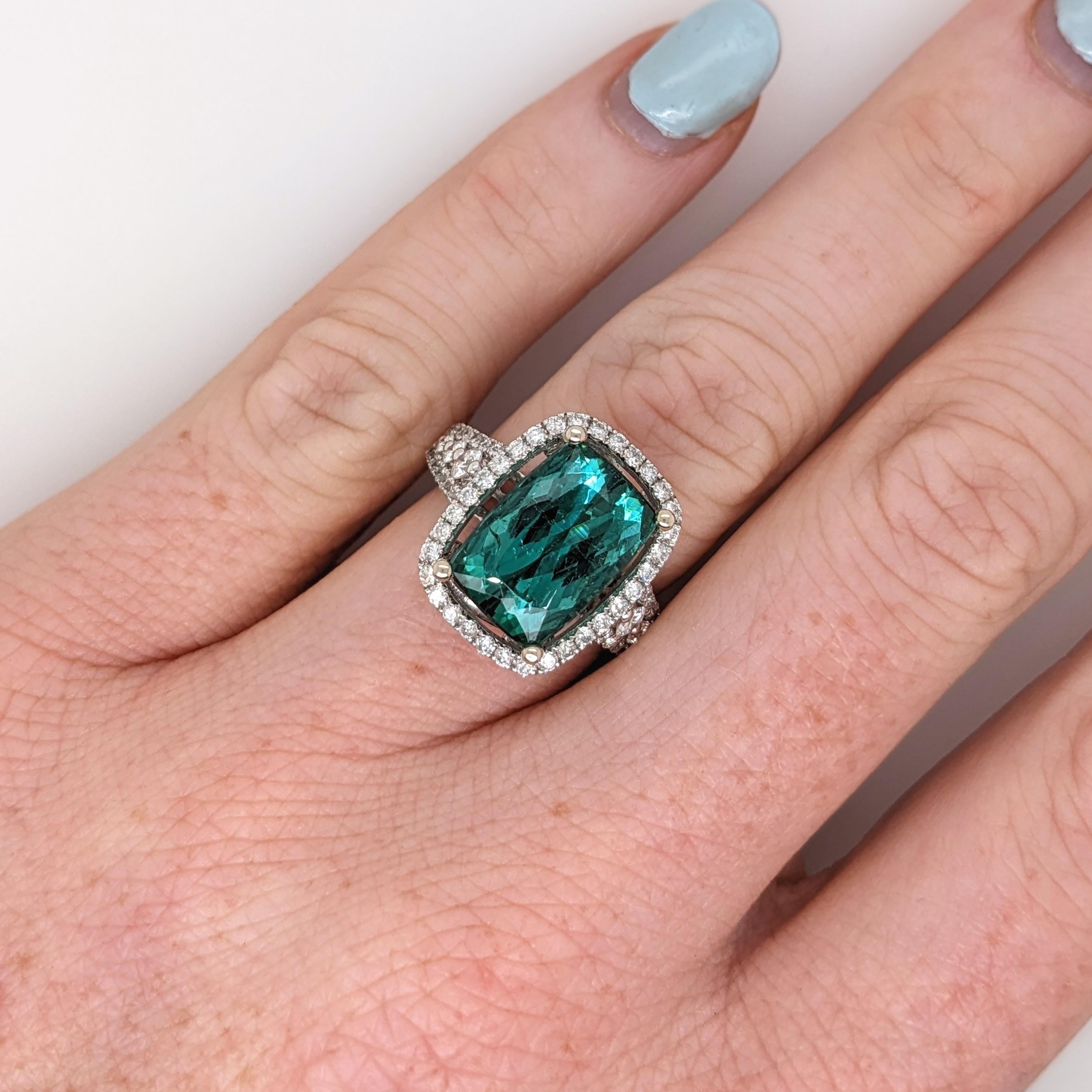 Presenting NNJ Designs' Summer Collection!

This beautiful estate ring features a 6.47 carat cushion cut indicolite tourmaline gemstone with natural earth mined diamonds set in solid 14K dual tone gold. This Indicolite Tourmaline ring makes a lovely