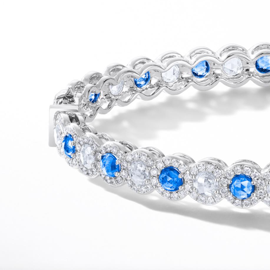 This beautiful bangle features 2.90 carats of rose cut sapphires flawlessly paired with 3.25 carats of rose cut diamonds. Both sapphires and diamonds are accented by smaller brilliant cut diamonds in a micro-pave setting. The brands' signature