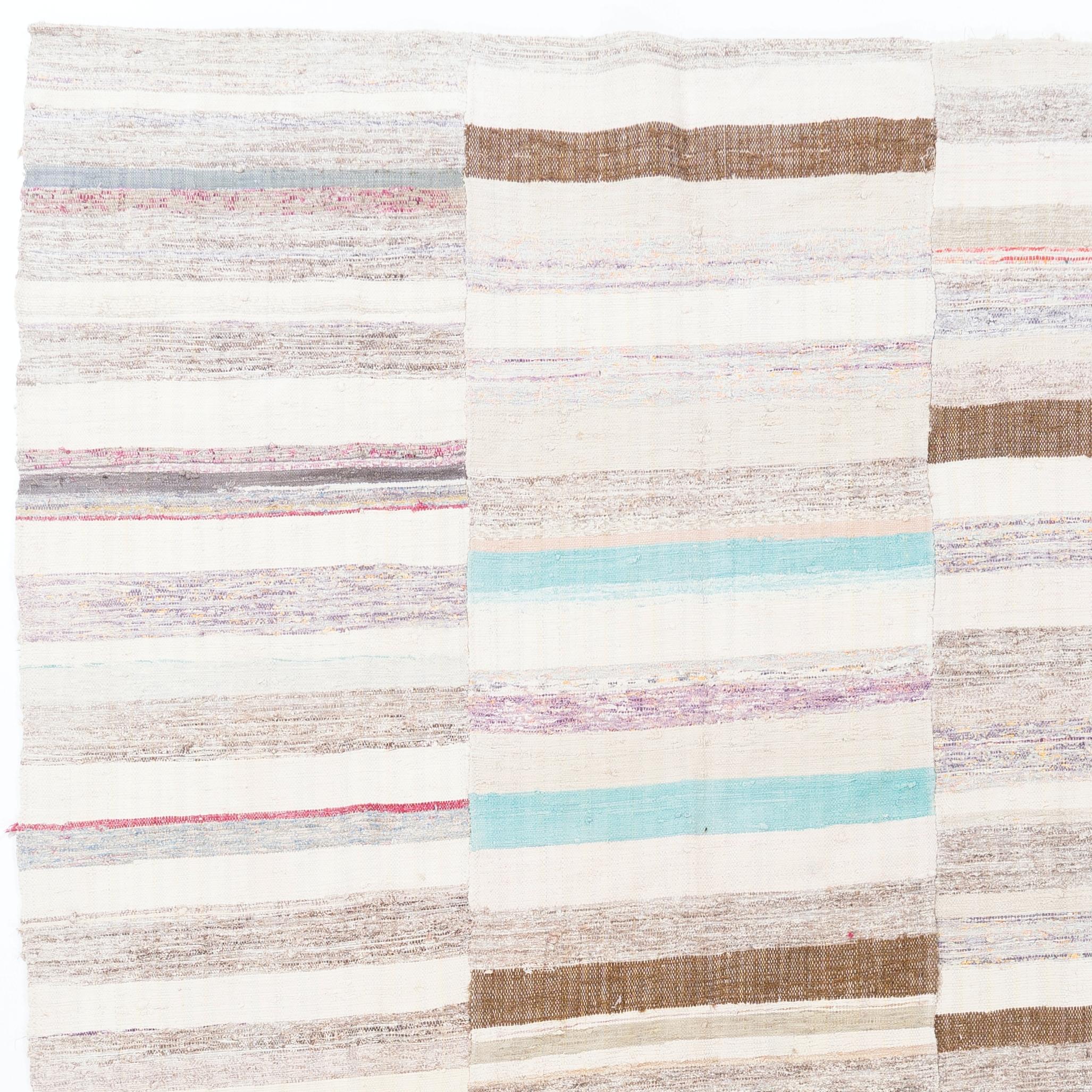 A vintage Turkish handwoven banded kilim (flat-weave) with a simple striped design in soft, faded colors, made of cotton. Sturdy and lightweight.  Measures: 6.4 x 11.4 ft.

If requested, we can hand-stitch vintage pieces flat-woven Kilim rugs like