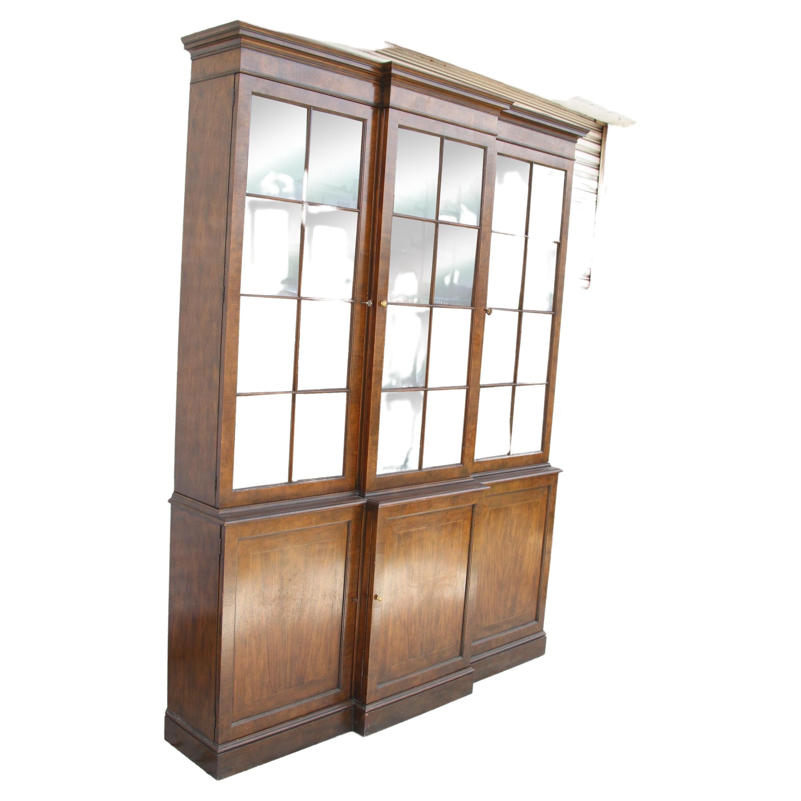 Baker Collection China Cabinet

Features generous shelving for china and collectible storage, interior lights and three concealed cabinets with shelving below.

65