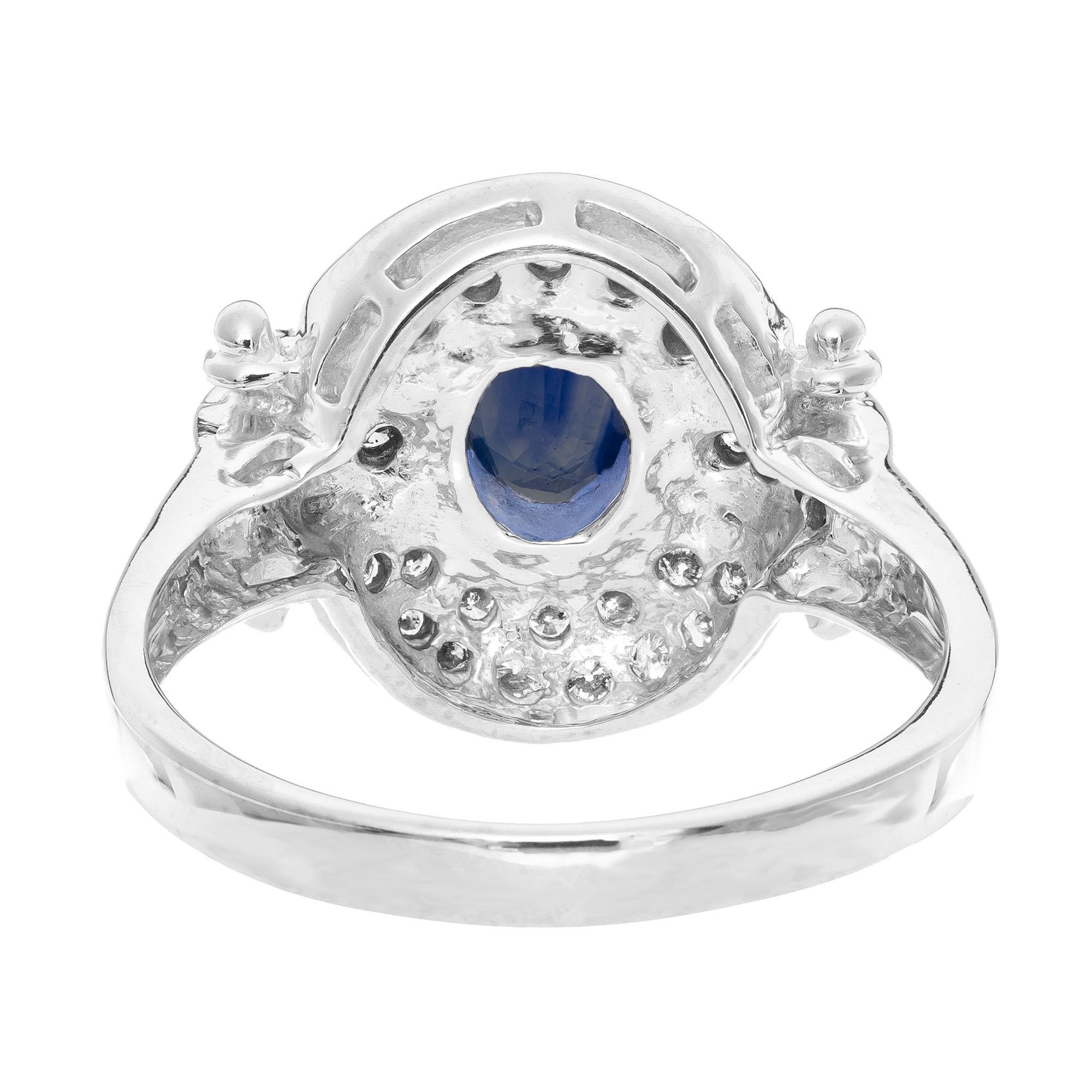 Women's .65 Carat Blue Sapphire Diamond Halo White Gold Cocktail Ring For Sale