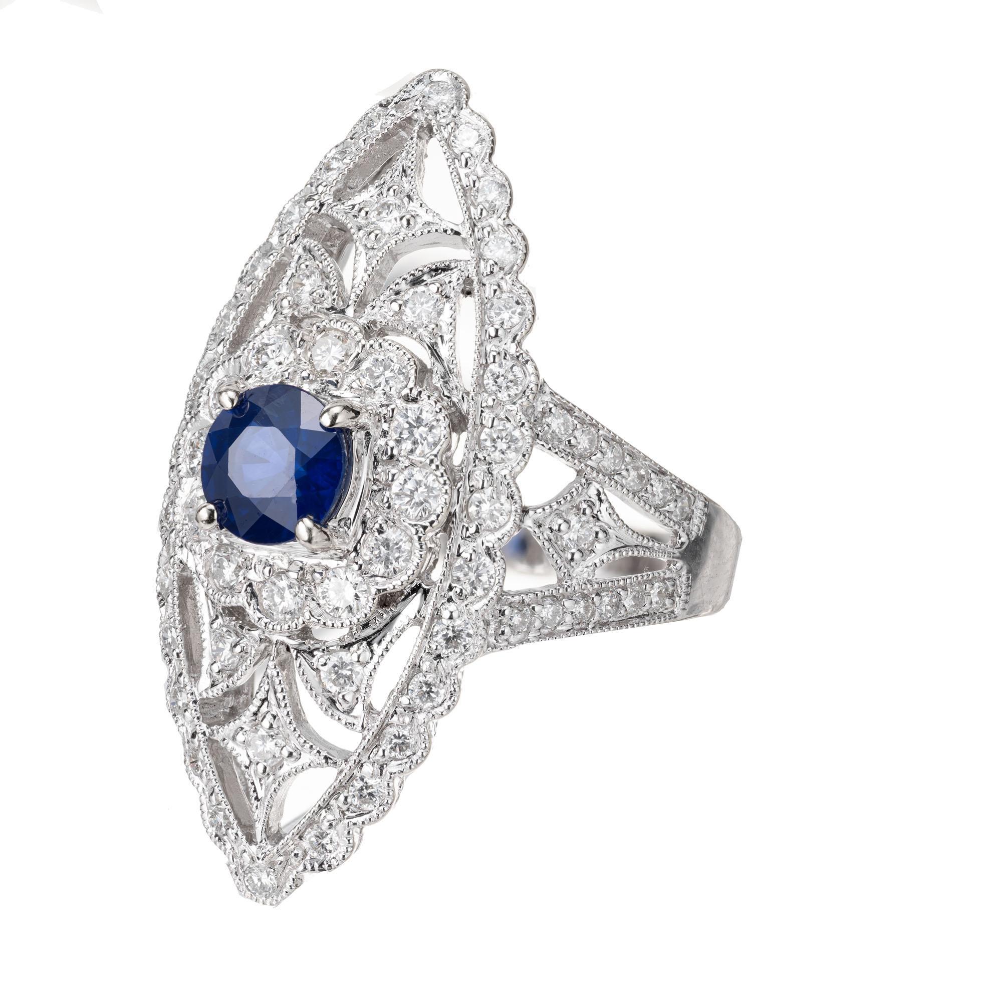 Large marquise shape open work cocktail ring set with a bright blue center sapphire and 72 round brilliant accent diamonds. 18 white gold

1 round blue sapphire SI, approx. .65cts
72 round brilliant cut diamonds G-H SI-I, approx. .85cts
Size 6.5 and