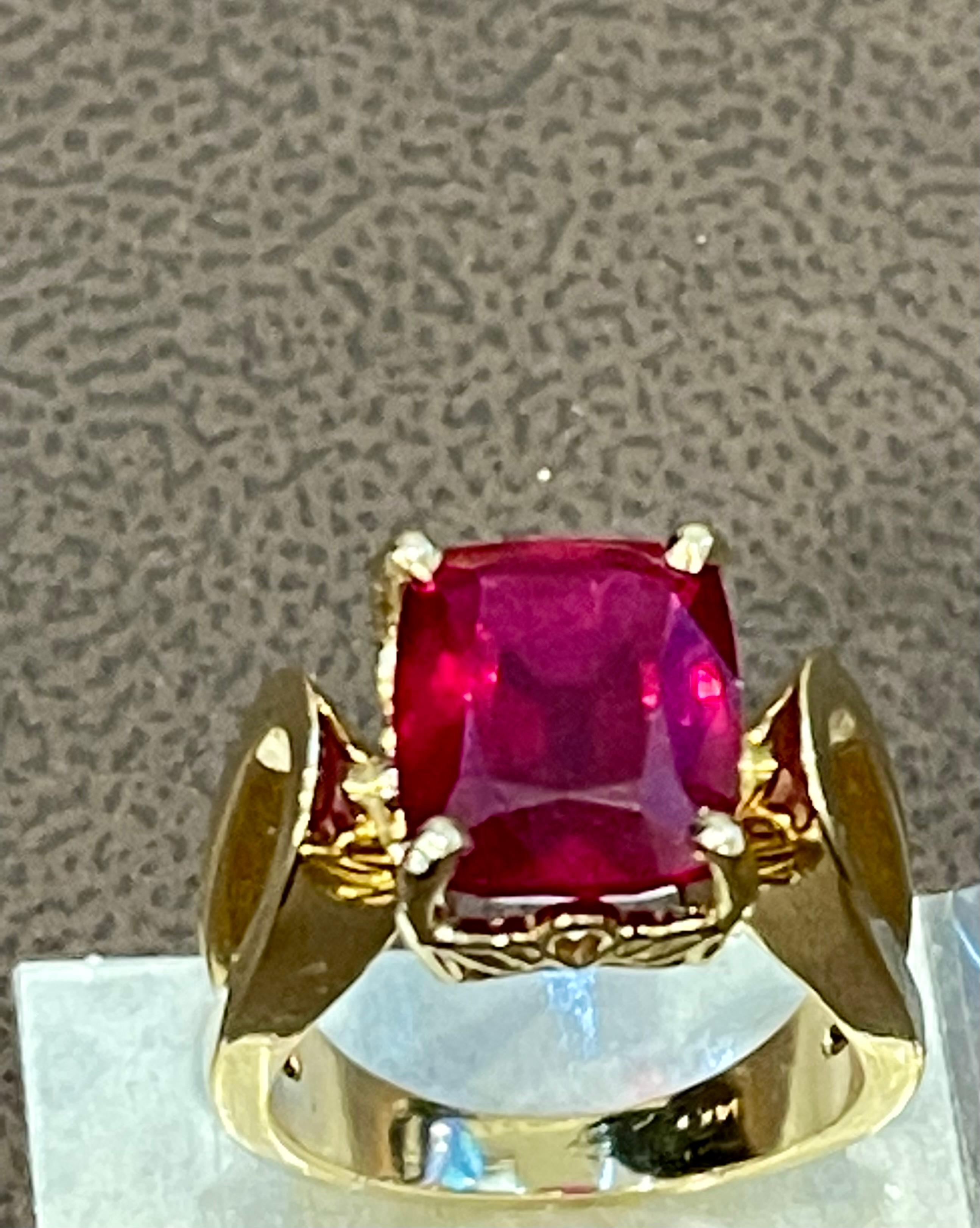6.5 Carat Cushion Shape Treated Ruby 14 Karat Yellow Gold Ring Size 5
 prong set
14 K Yellow  Gold: 7.5  gram
Stamped 14K
Ring Size 5 ( can be altered for no charge )
Large Exact 6.48  carat Cushion shape ruby Treated 


Its very hard to capture the