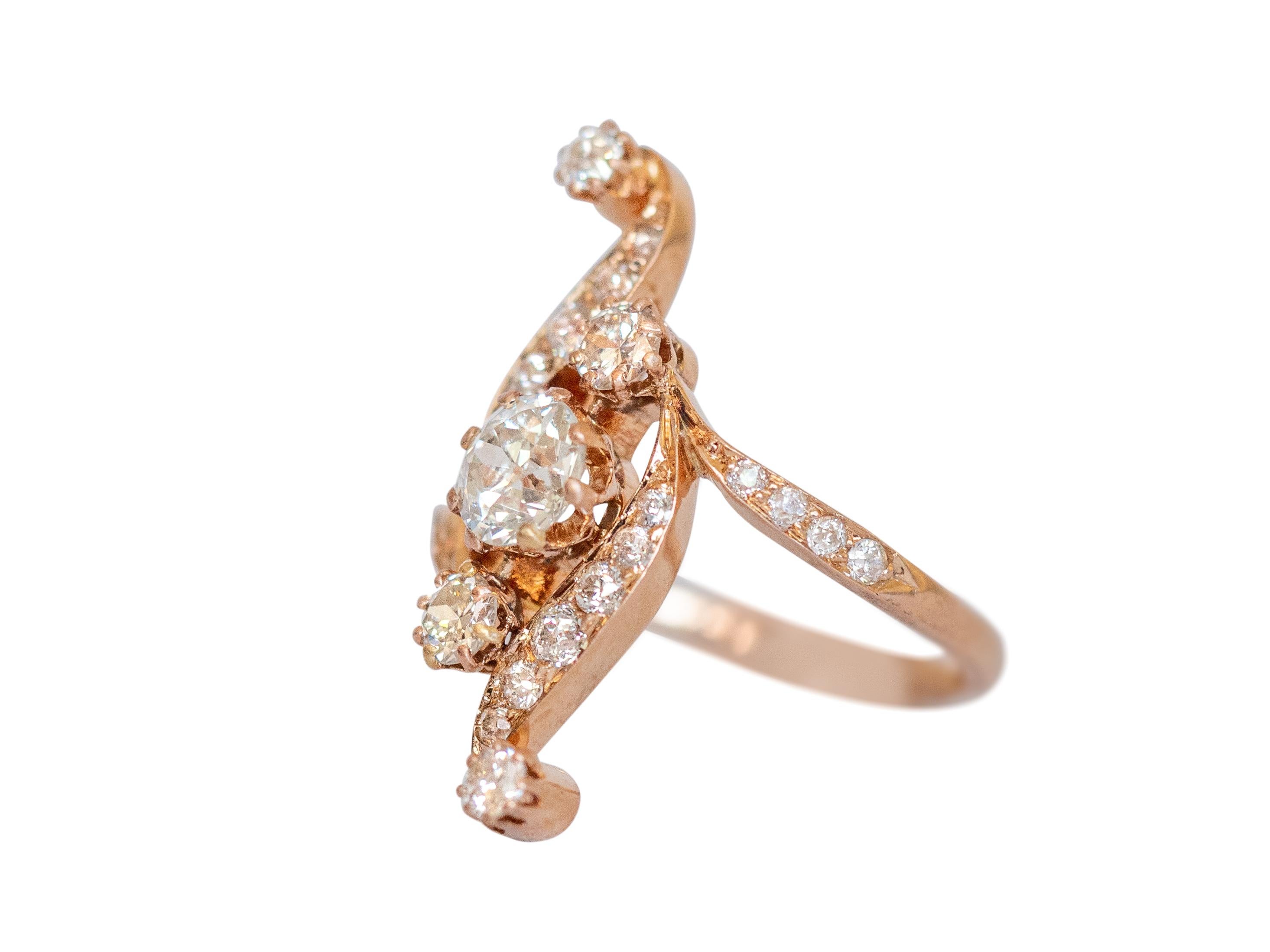Ring Size: 6
Metal Type: 14k Rose Gold [Hallmarked, and Tested]
Weight:  4 grams

Center Diamond Details:
Weight: .65 carat
Cut: Old European Brilliant
Color: I-J
Clarity: VS2

Side Diamond Details:
Weight: .40 carat, total weight
Cut: Old European
