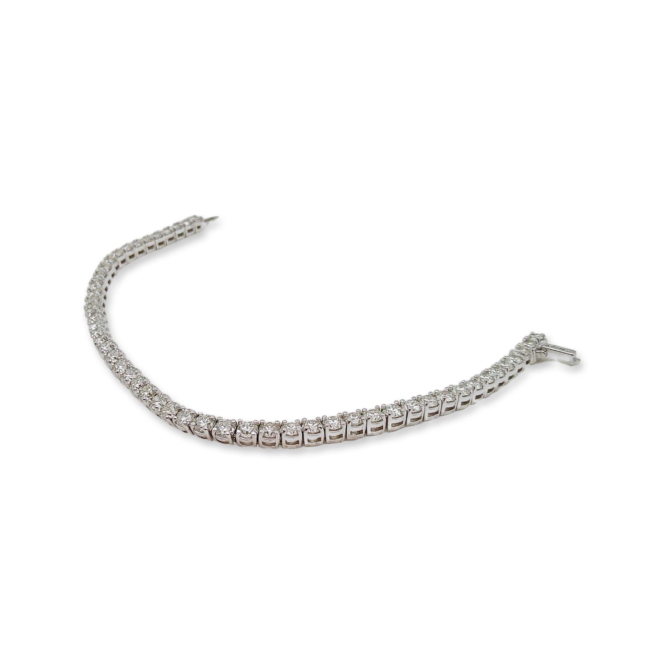 This stunning diamond bracelet is a contemporary piece and has yet to be worn. The setting is 14K white gold and features an astounding 6.5 carats of sparkling round diamonds. Often referred to as a “Tennis” bracelet, the contemporary diamond