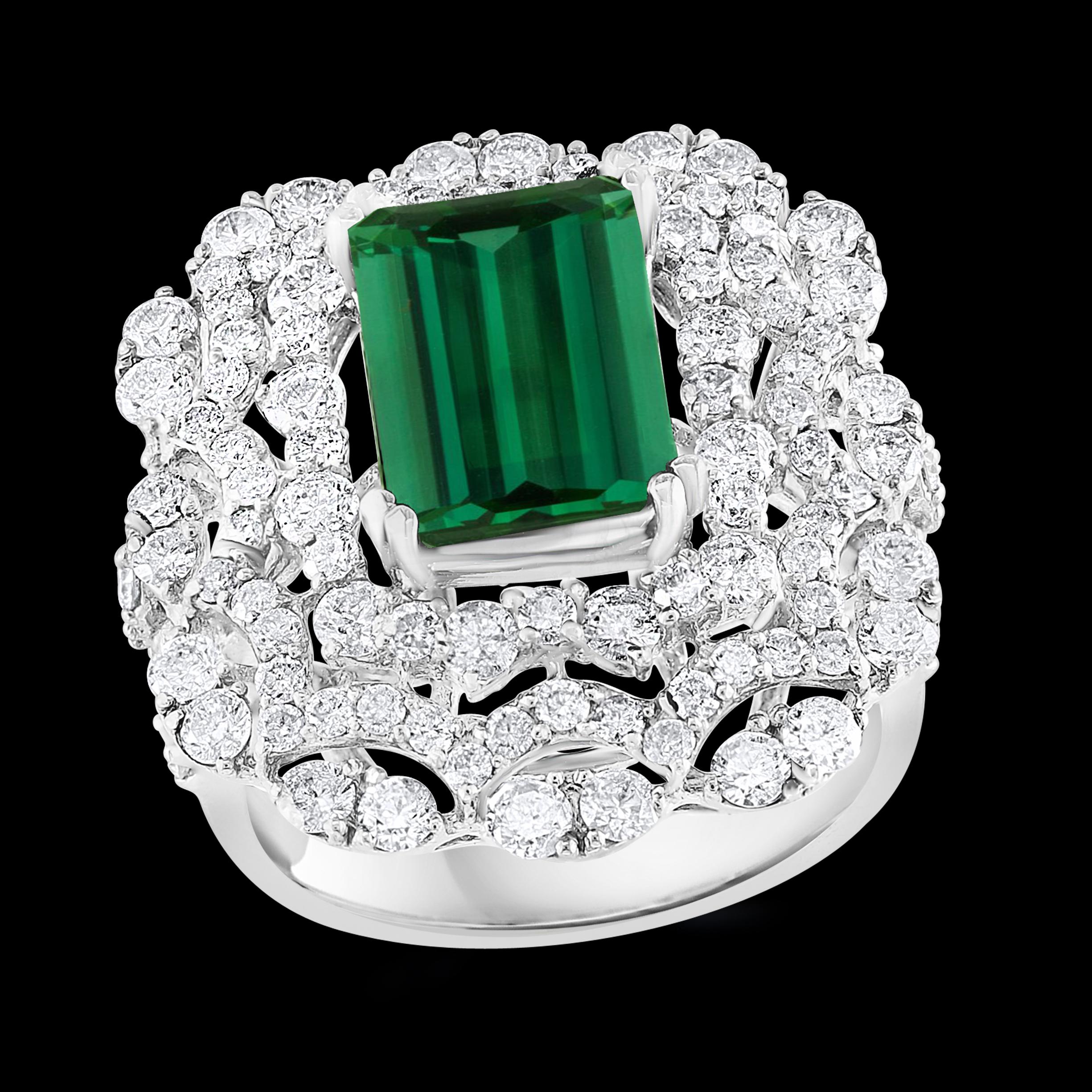 Approximately 6.5  Carat Green Tourmaline & 2.5 Carat Diamond Cocktail Ring 18 Karat White Gold Estate
This spectacular Cocktail ring   consisting of a single Oval  Shape Green Tourmaline  7.75  Carat.  The  Green Tourmaline  is surrounded by