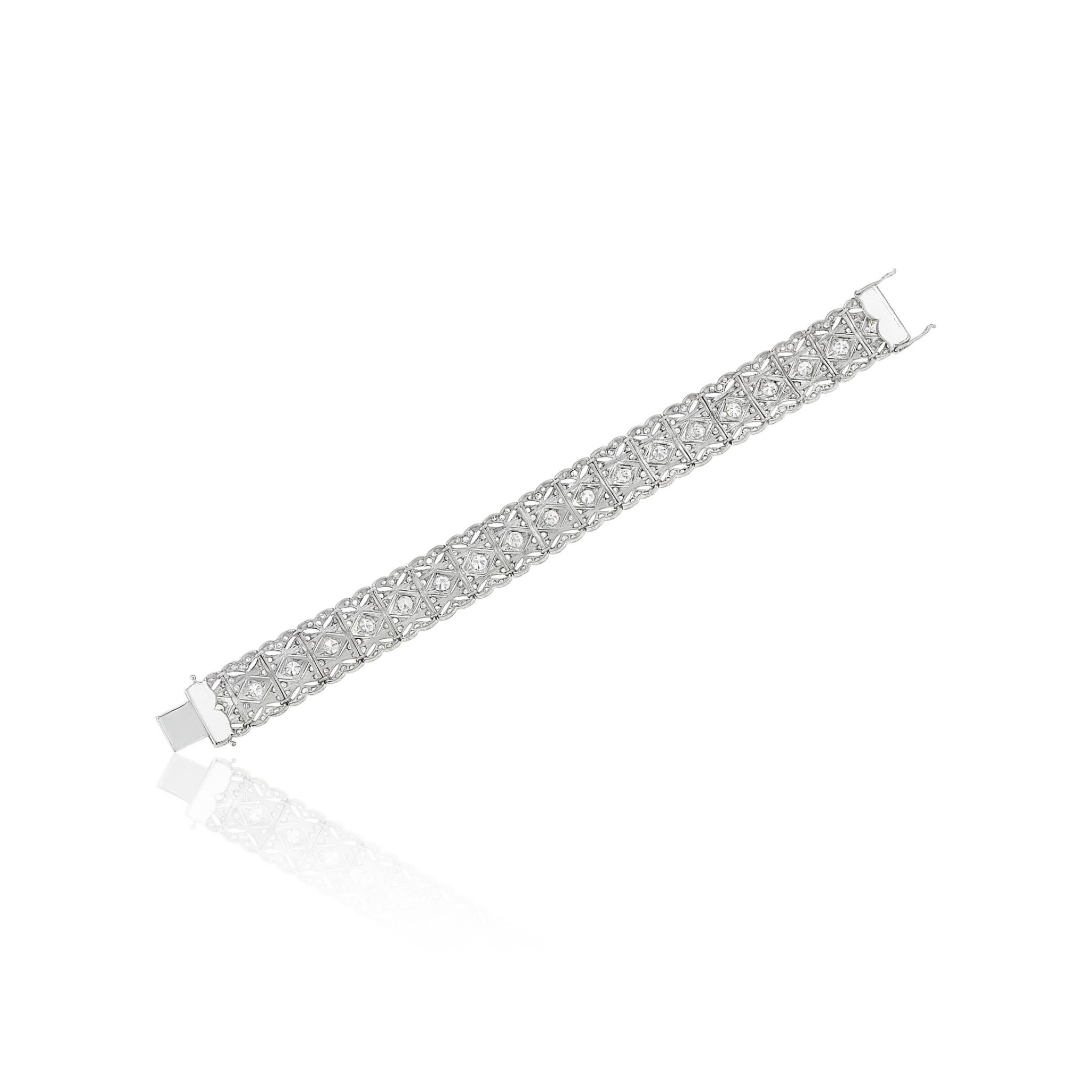 Old and single-cut diamonds, platinum

Diamonds: approximately 285 old and single-cut with approximate total weight of 6.50 - 7.00 carats.
Diamonds: H to I colour, predominantly VS to SI clarity, a few I clarity examples, some chipped and nicked.

-