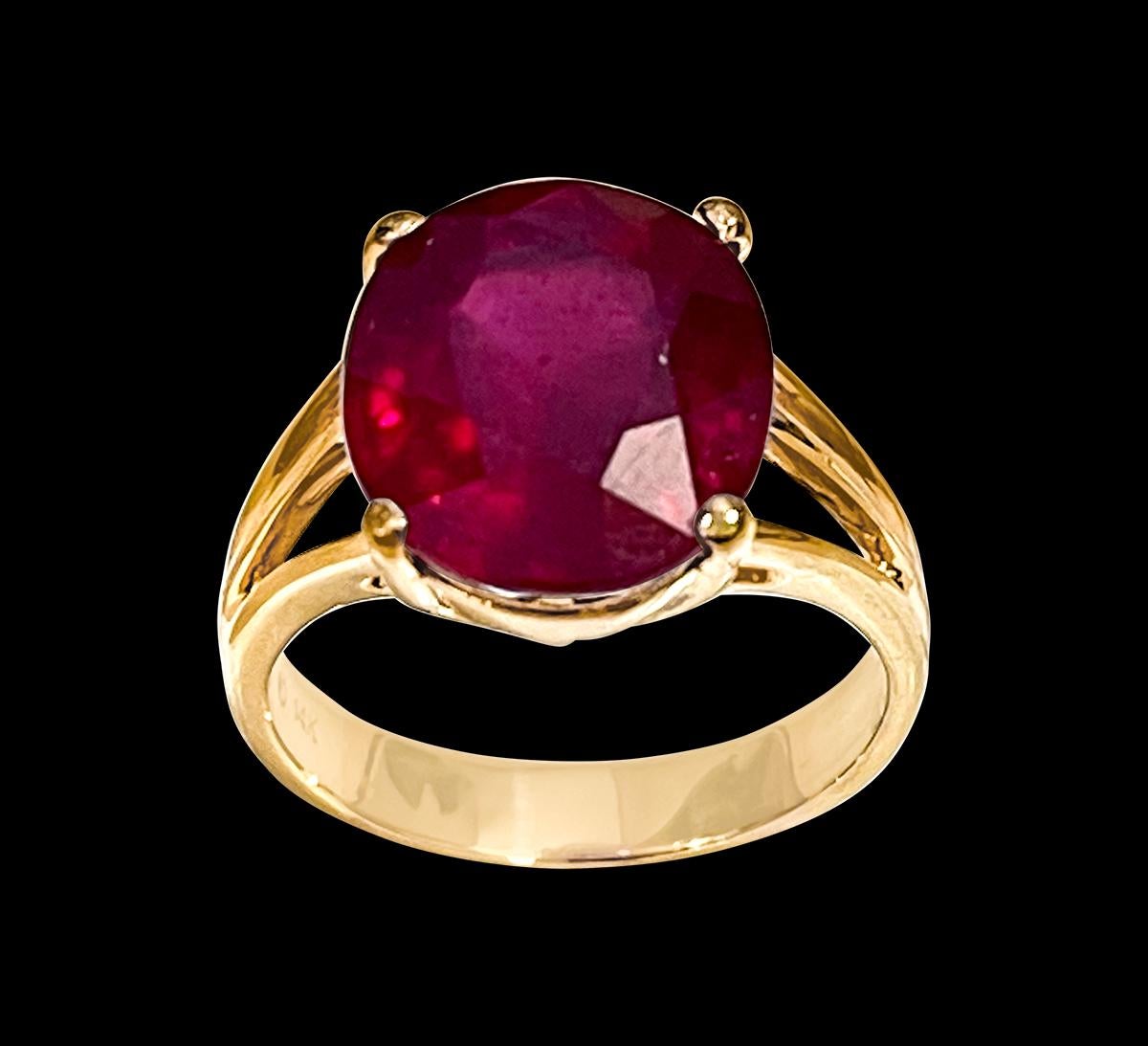 10X12  Oval  Cut  approximately 6.5 Carat Treated Ruby  14 Karat Yellow Gold Ring Size 5.5
Its a treated ruby
 prong set
14 Karat Yellow Gold: 4.9gram
Ring Size 5.5 ( can be altered for no charge )
Simple ring for the people  who don't like bling of